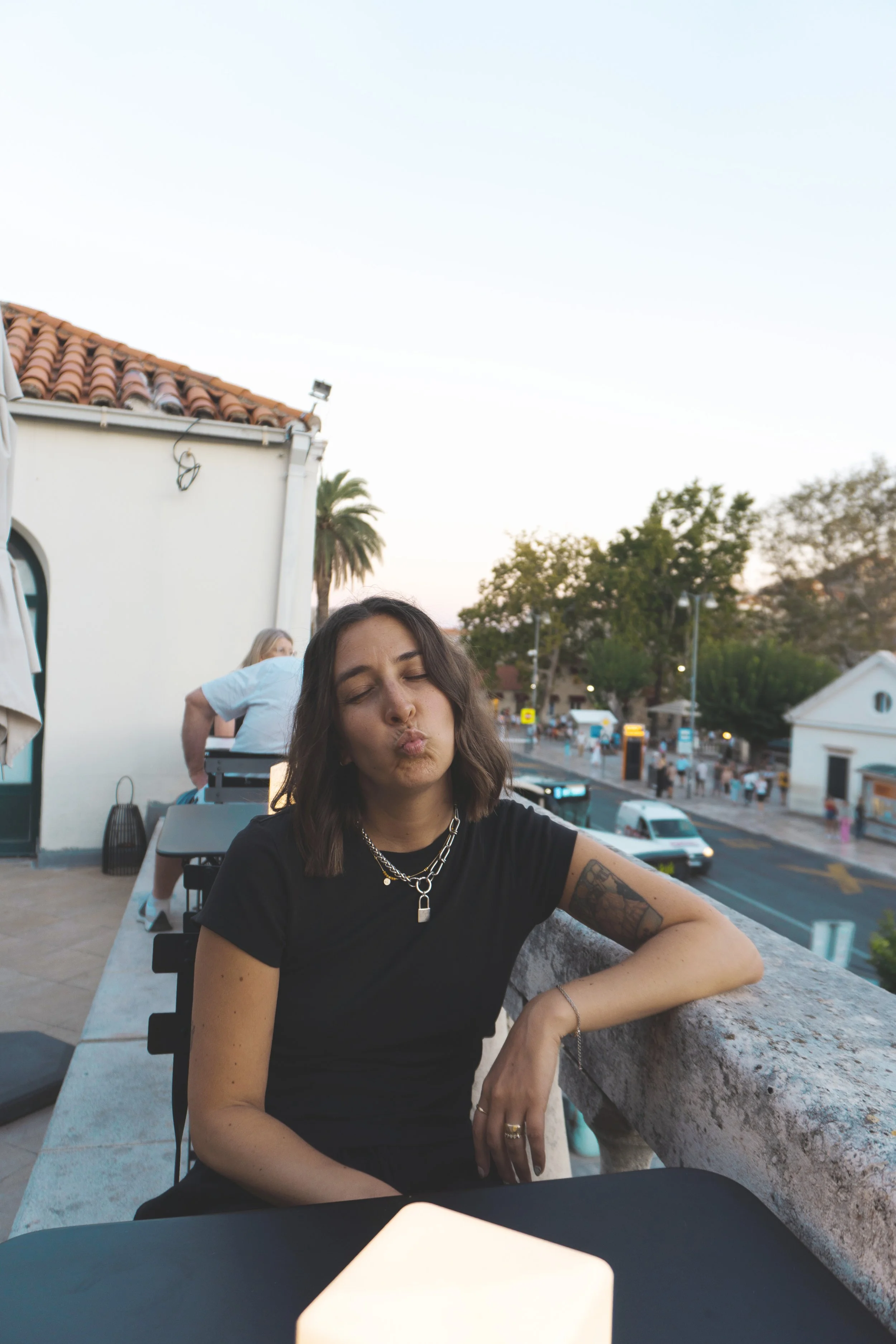 girl sitting outside at SILK restaurant dubrovnik