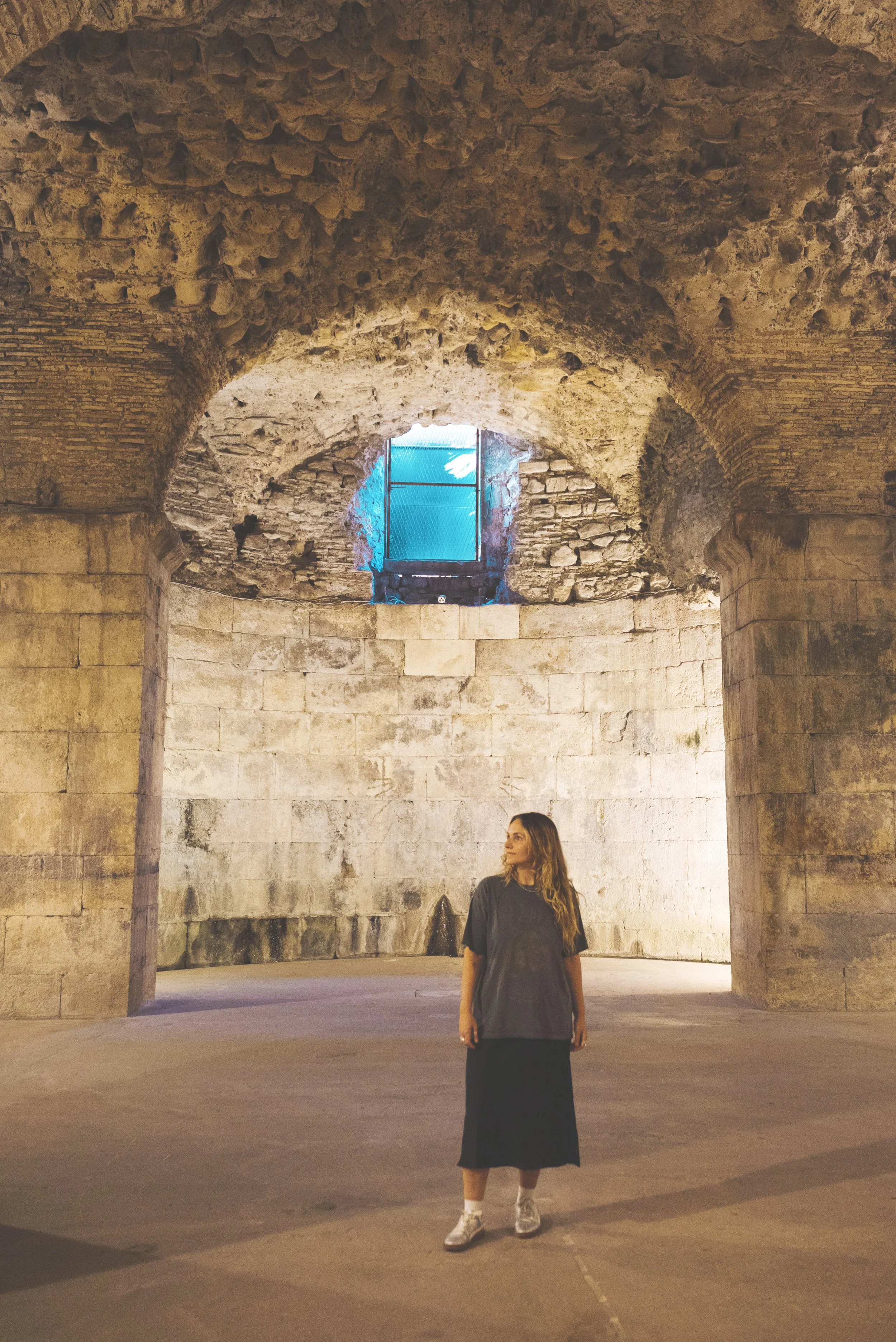 girl walking in diocletian's palace split croatia