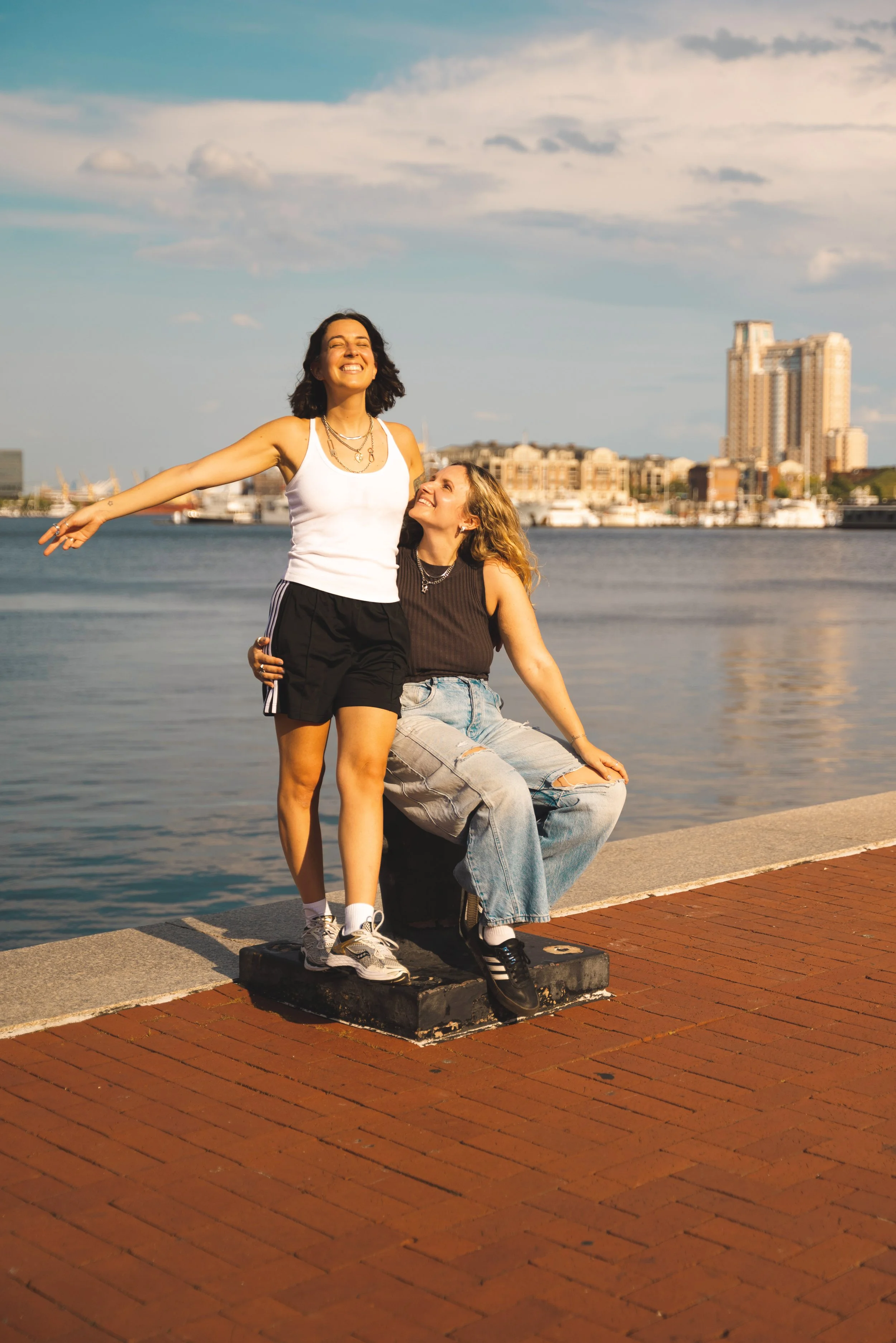 two girls standing in front of Inner Harbor Baltimore