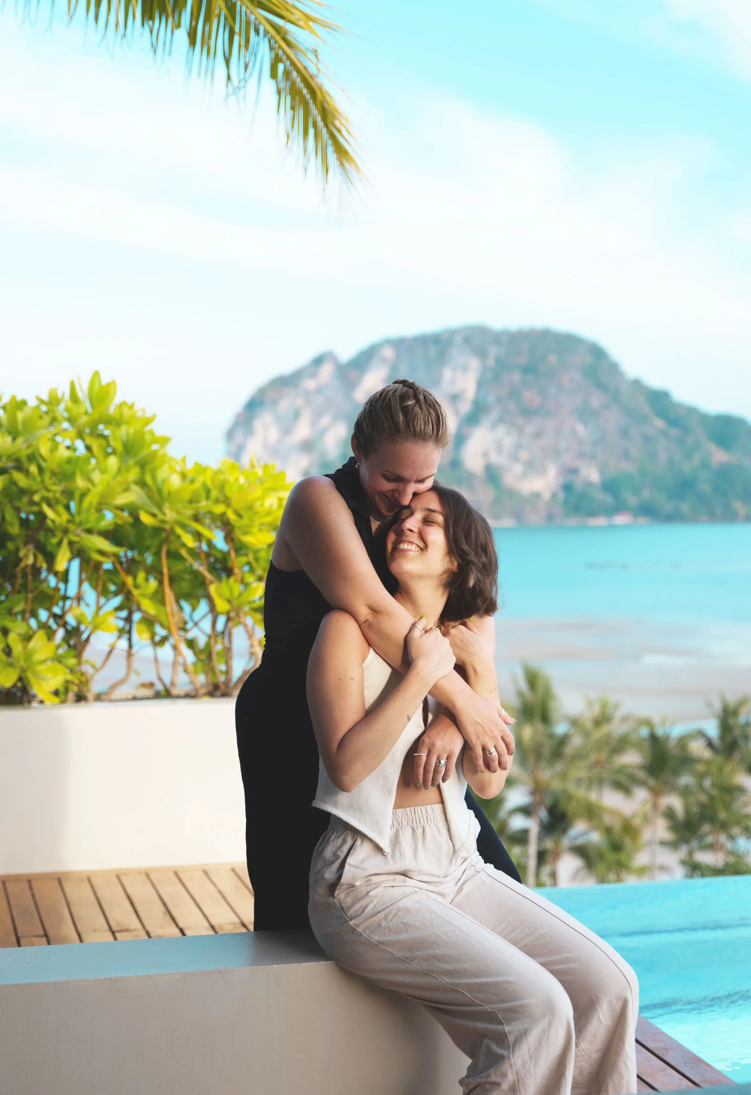 two girls sitting overlooking koh yao yai thailand