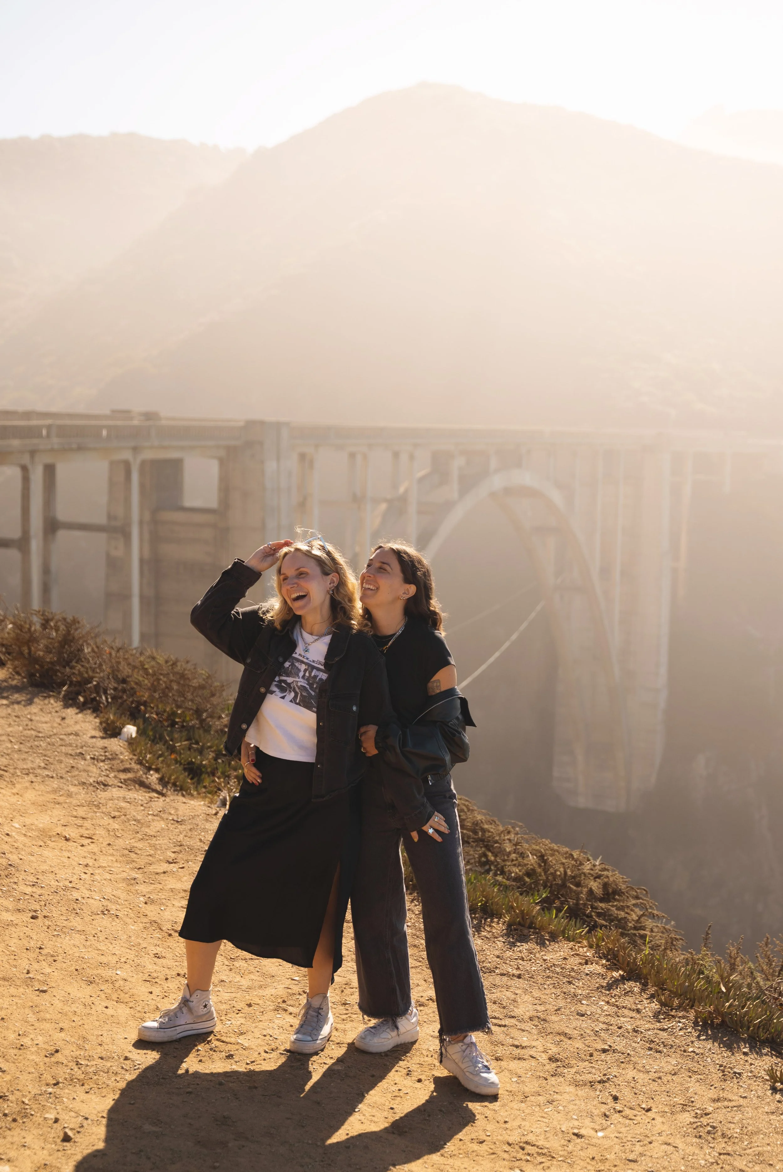 two girls in front of bixby bridge california big sur
