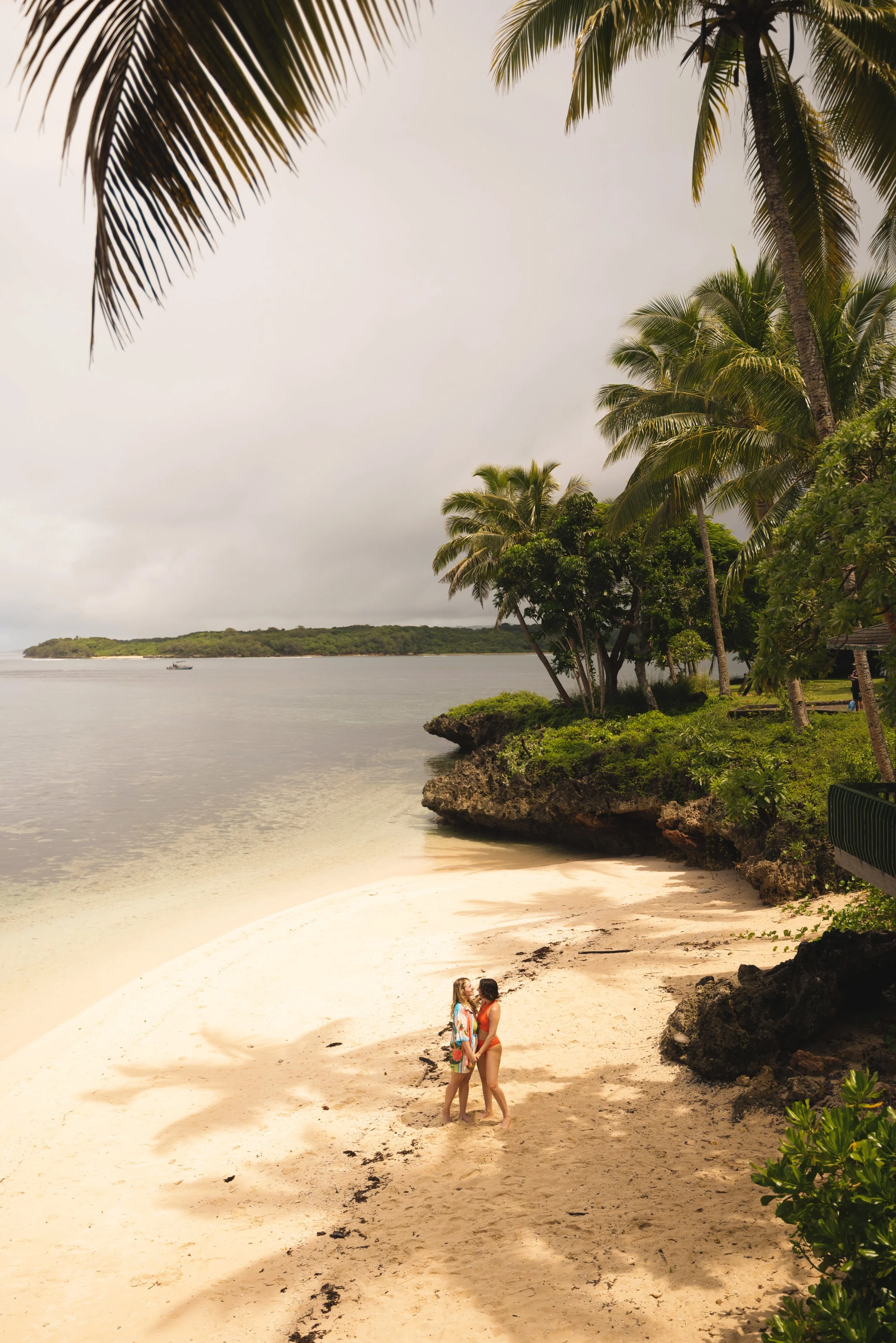 two girls standing on shangri la beach fiji
