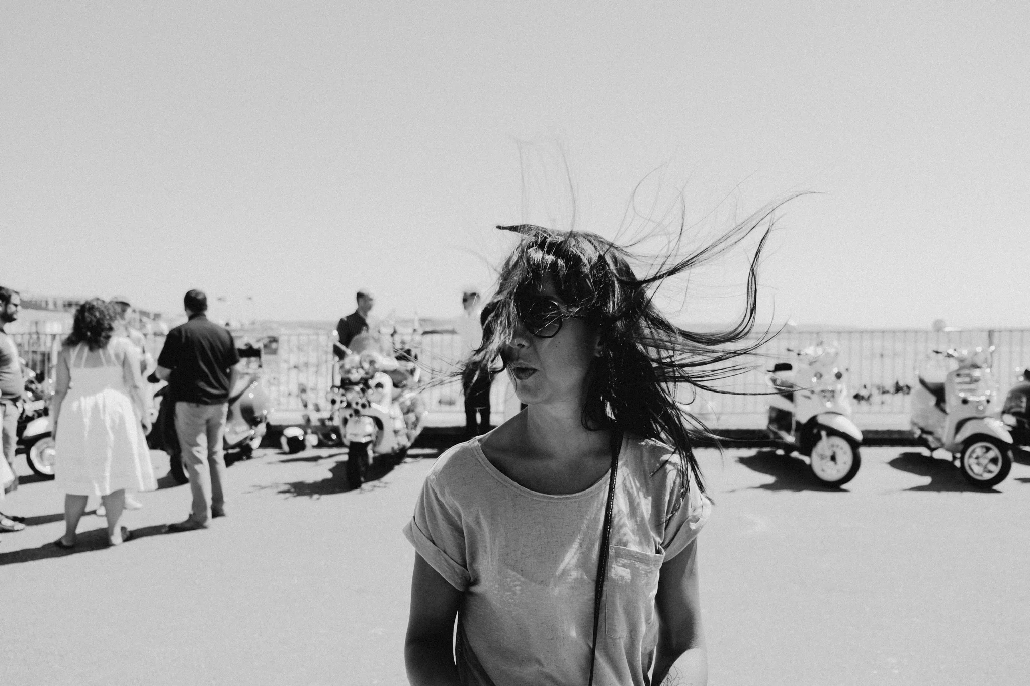 Hair flying in the wind at Porthcawl beach on a warm summers day 