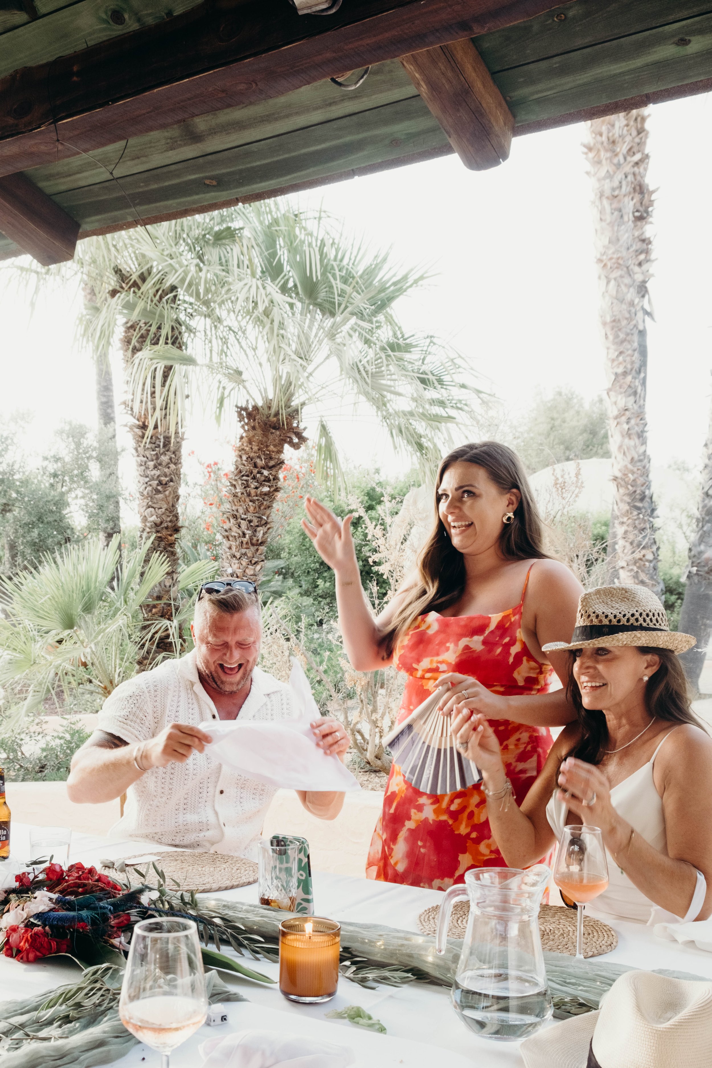 Three women and one man enjoying a wedding celebration in Ibiza, Spain. Shot by Jason Evans photography Bridgend