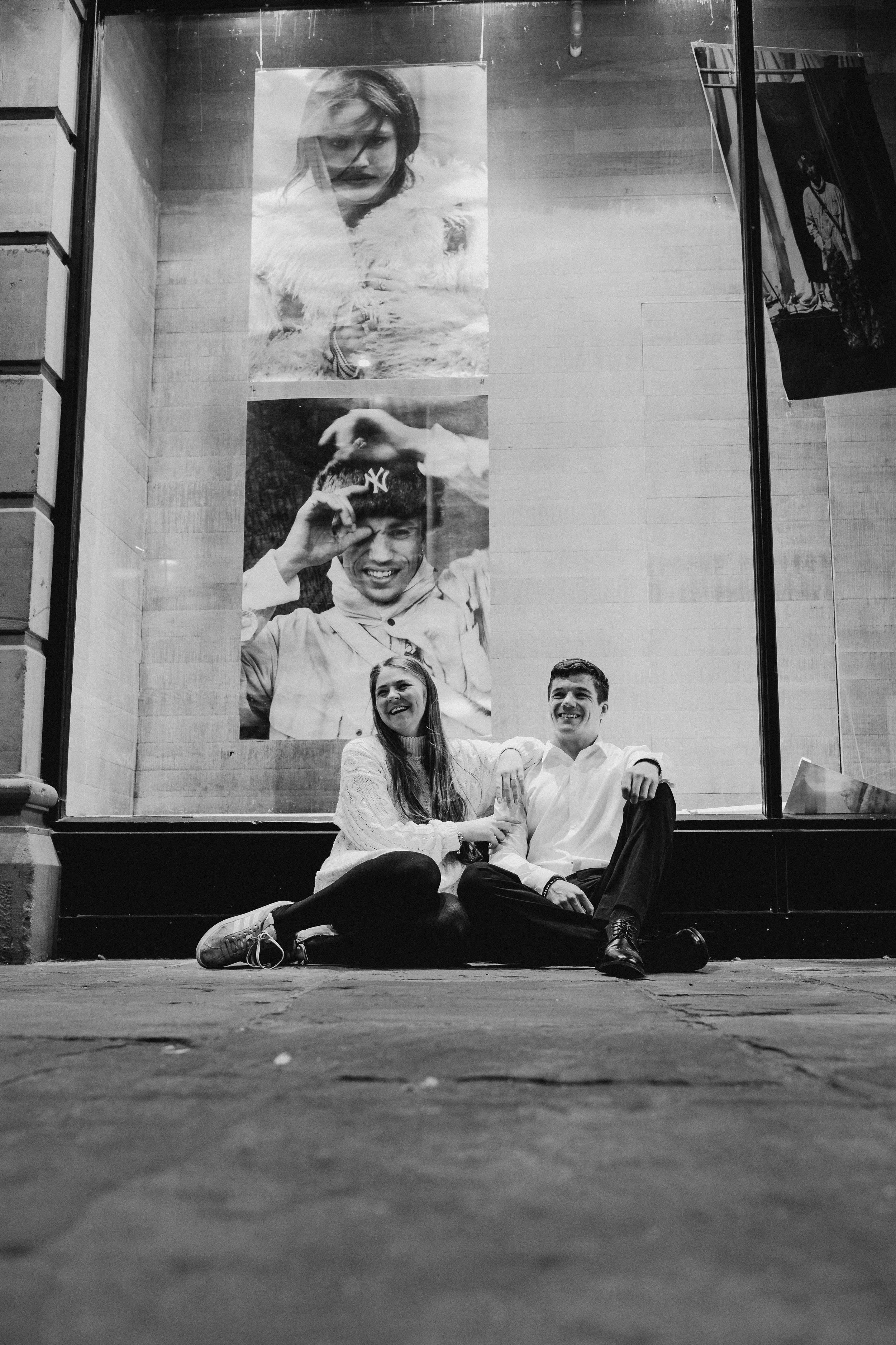 engaged couple laughing together