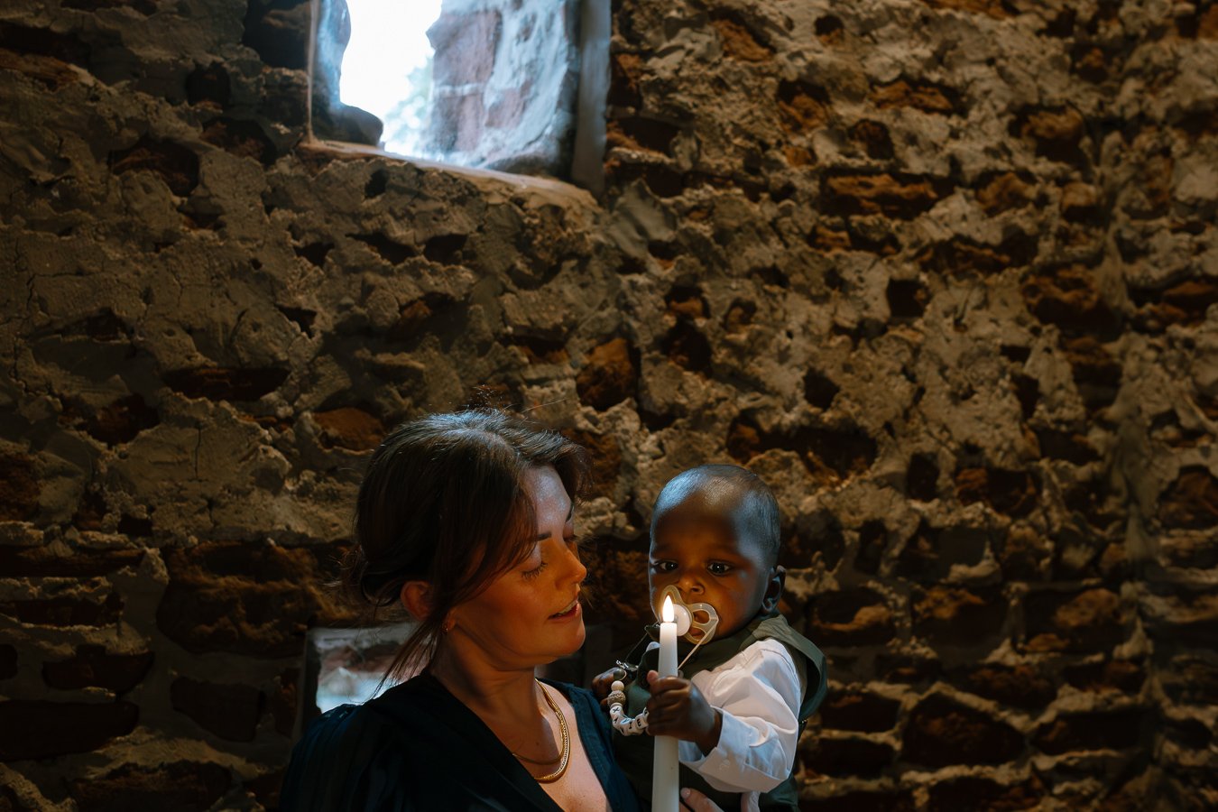 Baby illuminated by candle light 