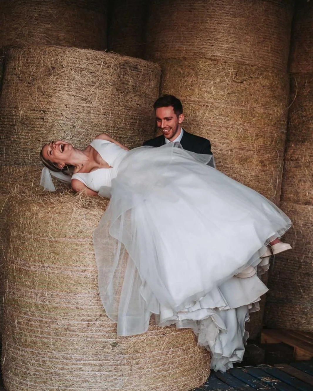 Photo of the day.

Portrait shots are supposed to be fun too. This is Chloe&rsquo;s attempt at climbing on to a hay bail in a wedding dress. Easy 😂