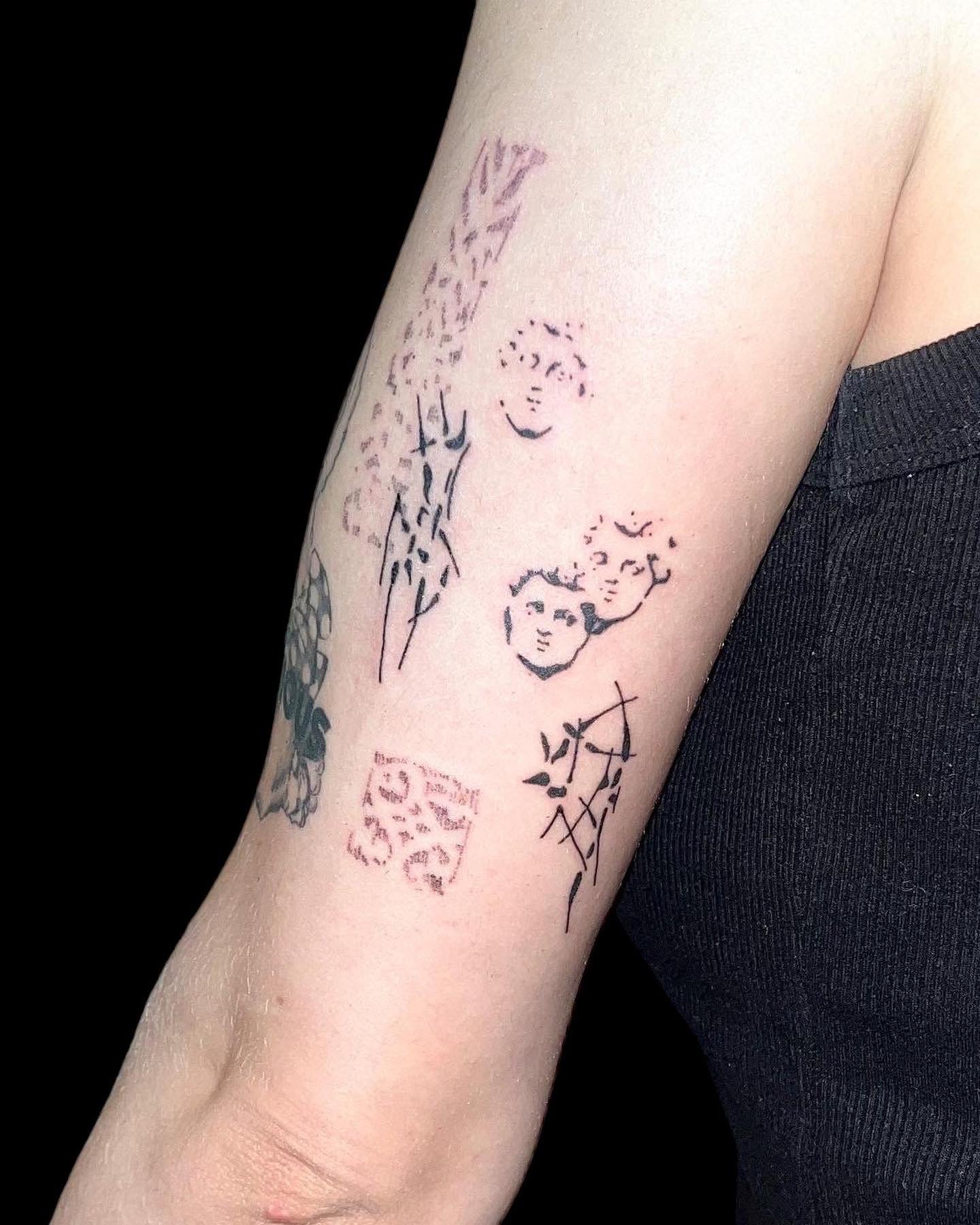 Composition of abstract hand poked tattoos by ay seed.JPG