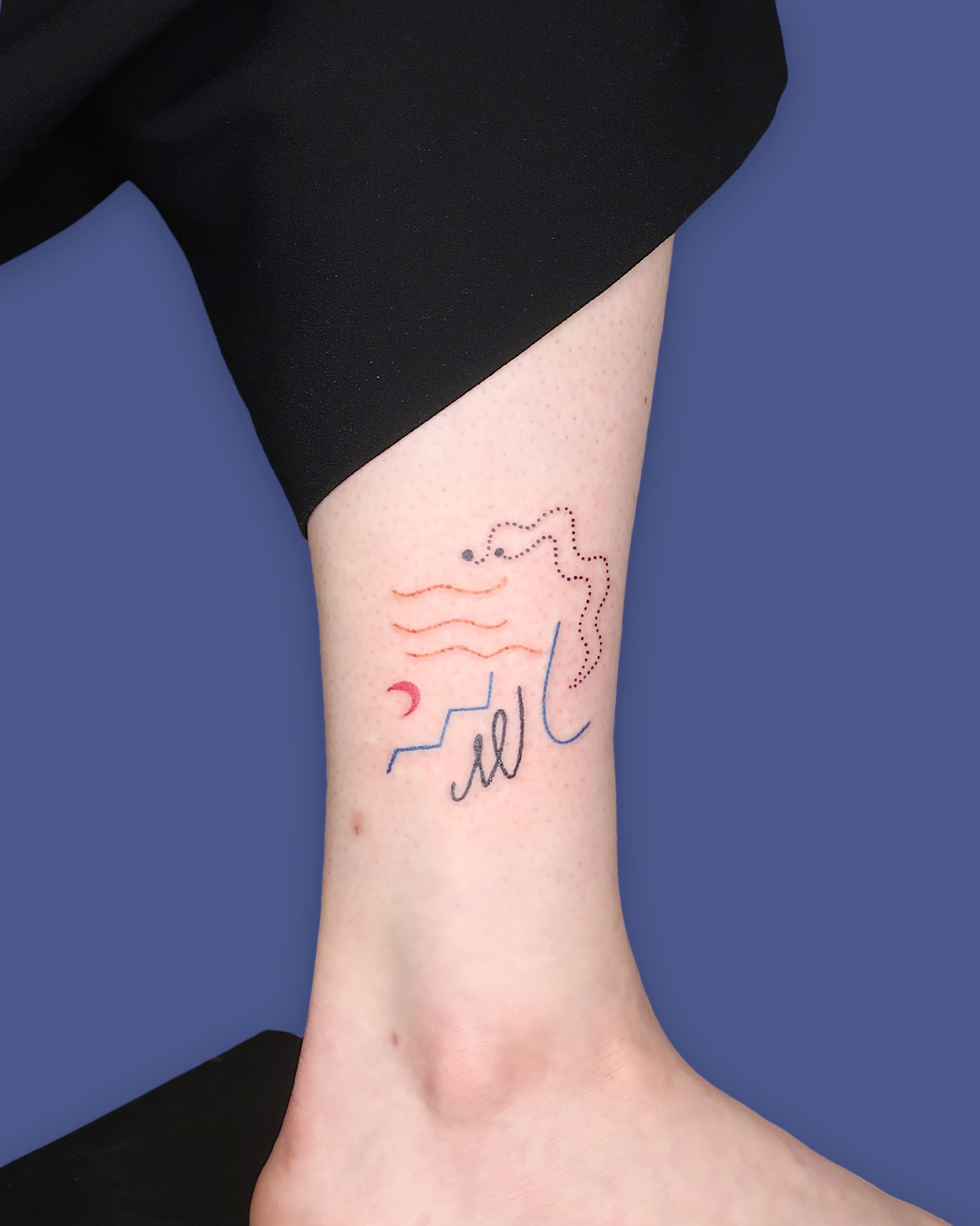 Abstract composition with simple elements and colors tattooed on ankle by Madame Unikat.JPG