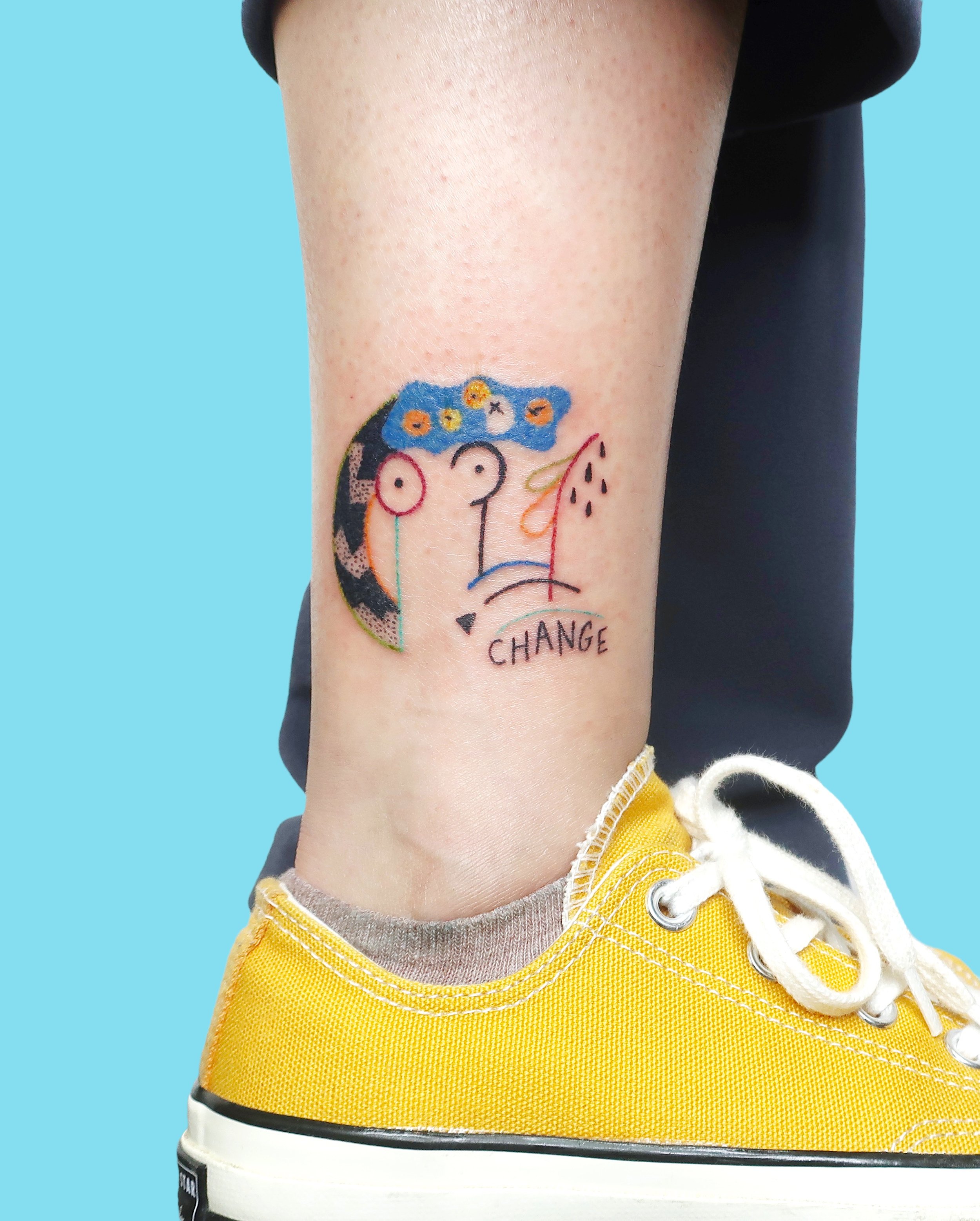 Tattoo of a matisse inspired drawing with a woman bust oranges and the word change by Madame Unikat.JPG