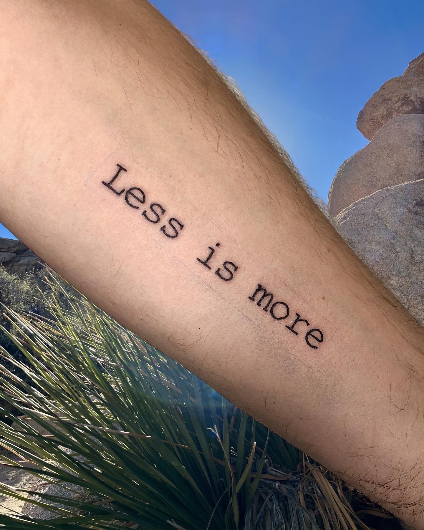 Less is More typo tattoo on lower inner arm .JPG