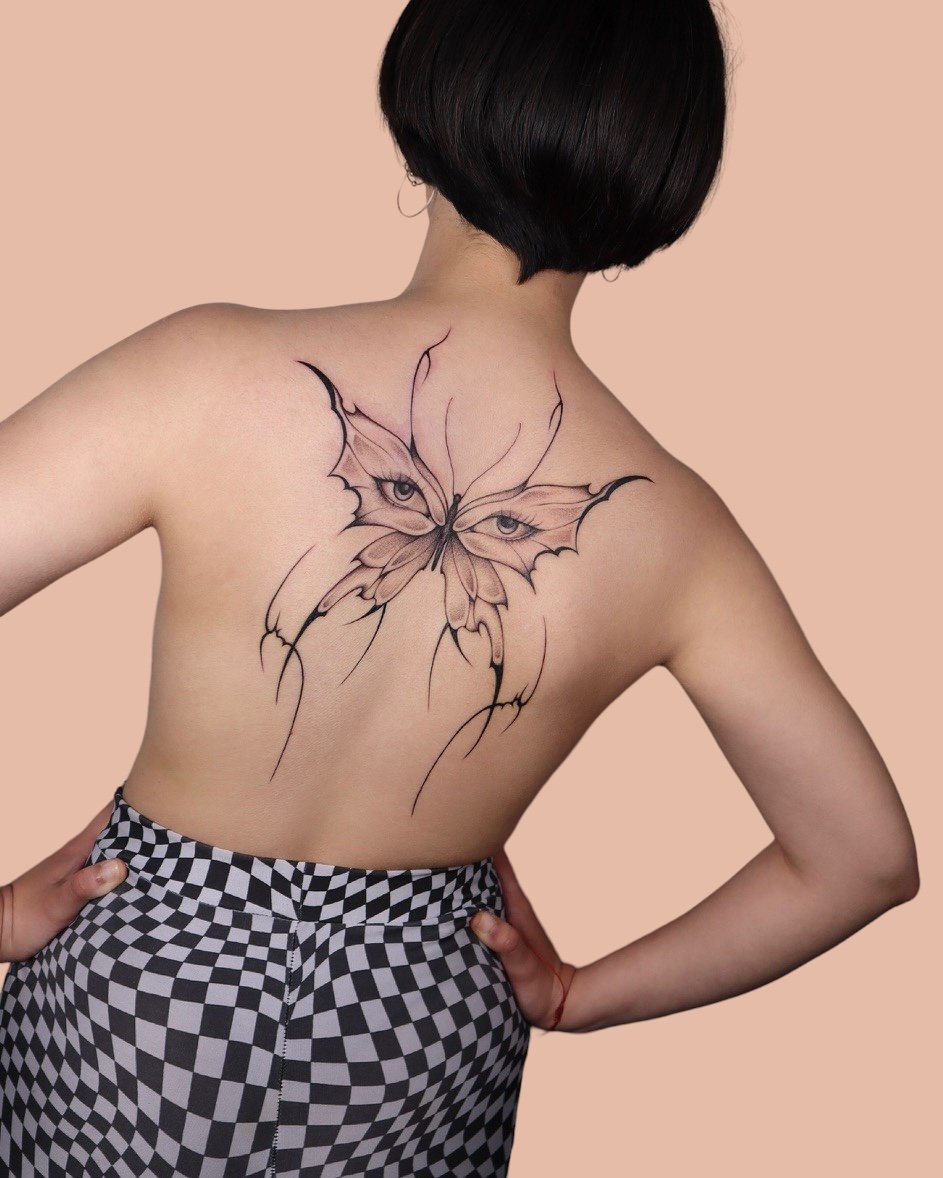 Butterfly on back tattooed by Sisterxserpent.JPG