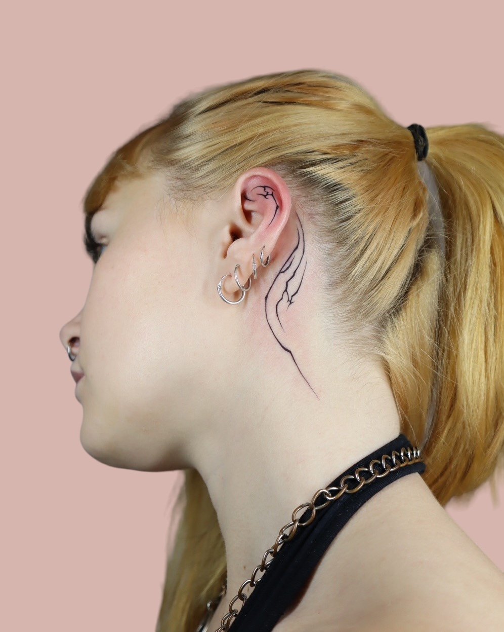 Ear tattooed by Sisterxserpent.JPG
