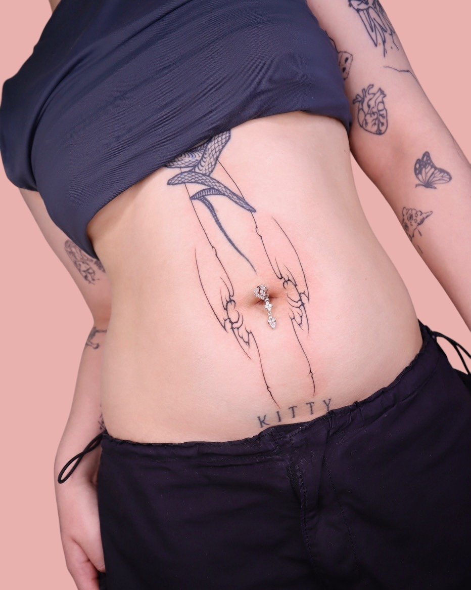 Stomach tattooed by Sisterxserpent.JPG