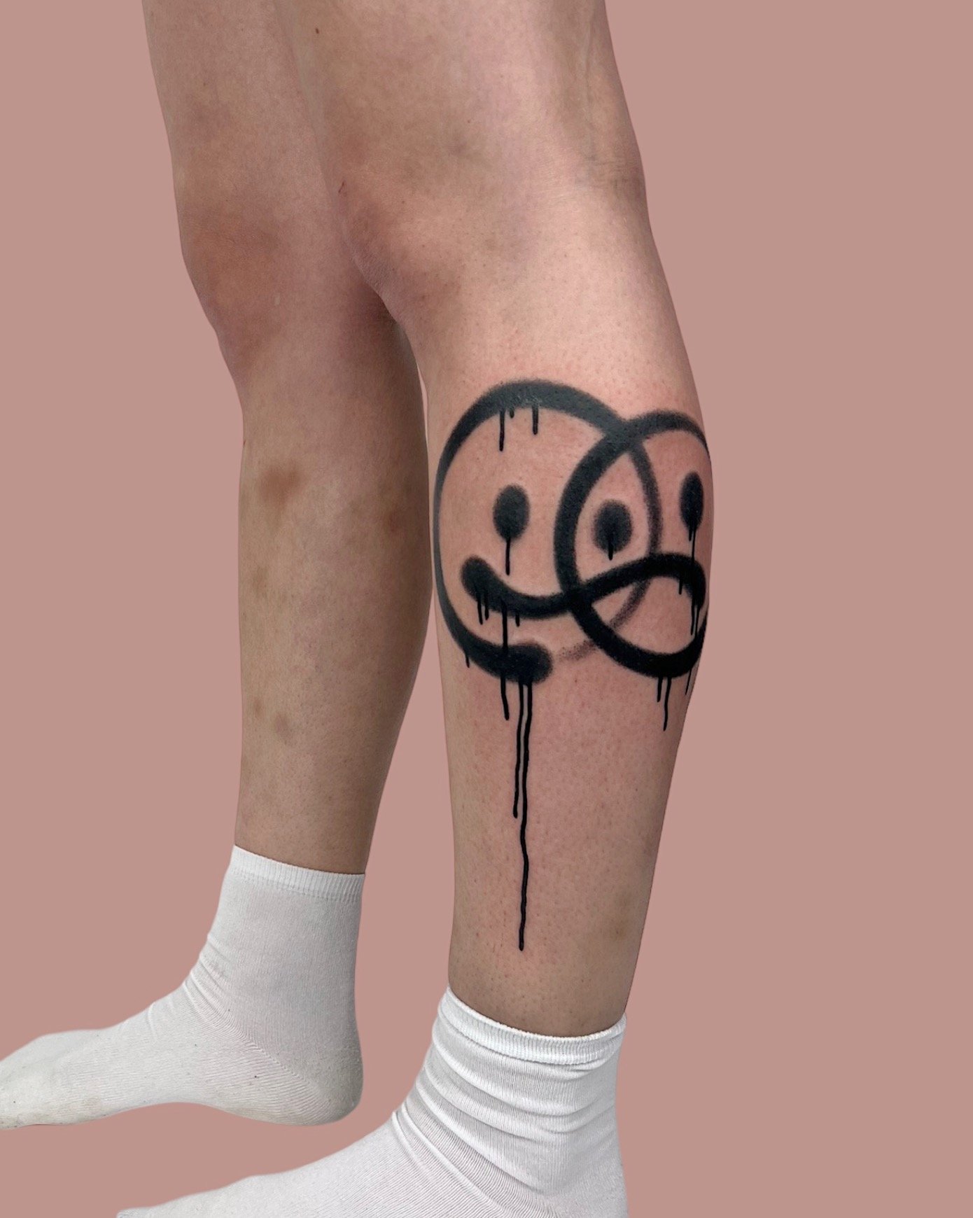Double smiley tattoo on leg by Vitya lyuty.JPG