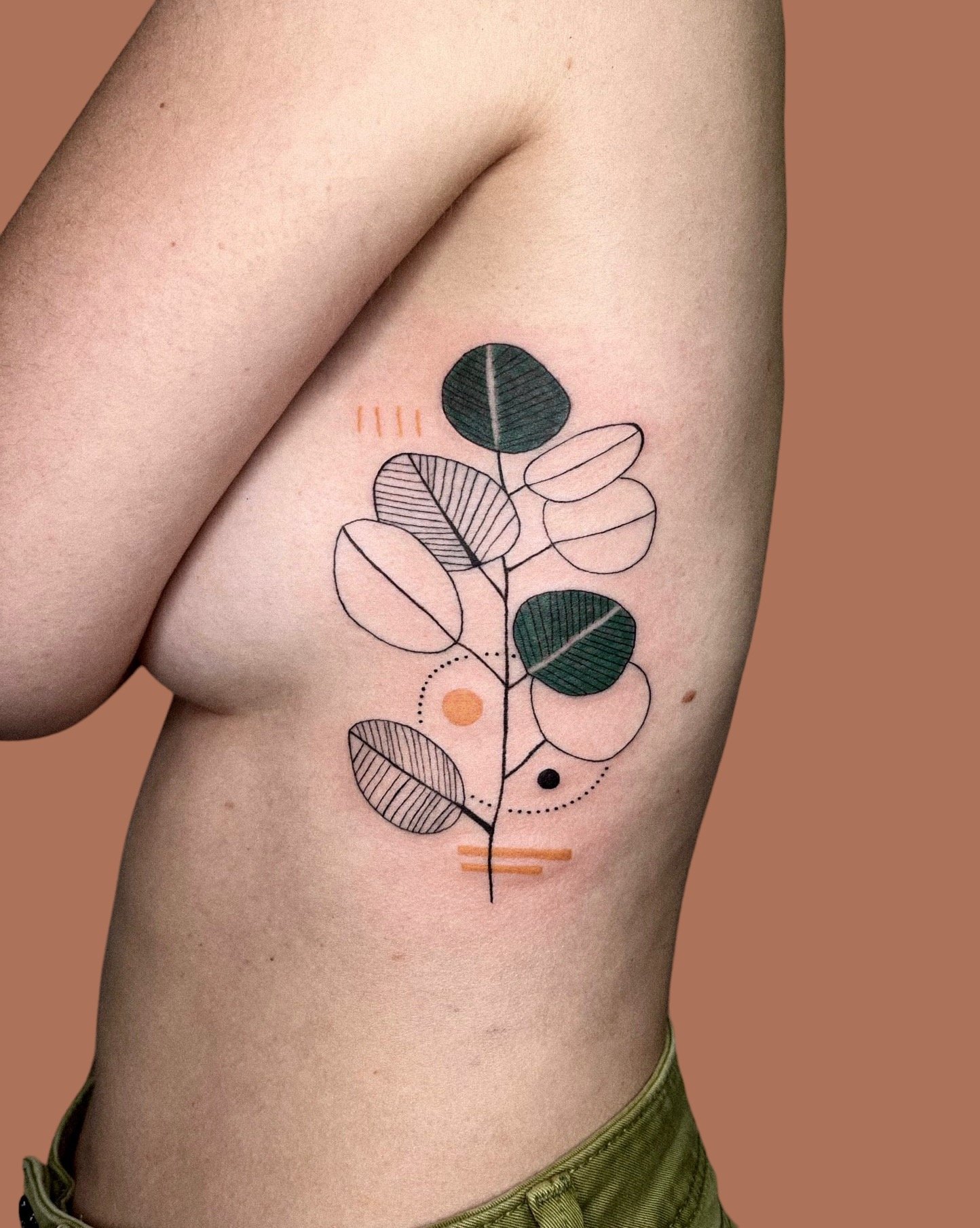 Graphic branch tattoo on ribs by kirii lines.JPG