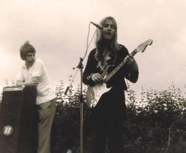 Uli's 2nd show with his new sunburst Stratocaster guitar. His then friend and "manager", Friedrich (Bantel) Budde watching from the left. Open air in Hannover, Auf der Bult, 5. June 1971.