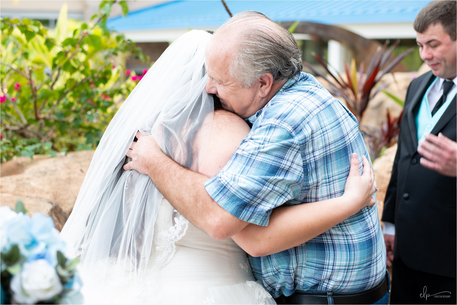 Dad hugging bride
