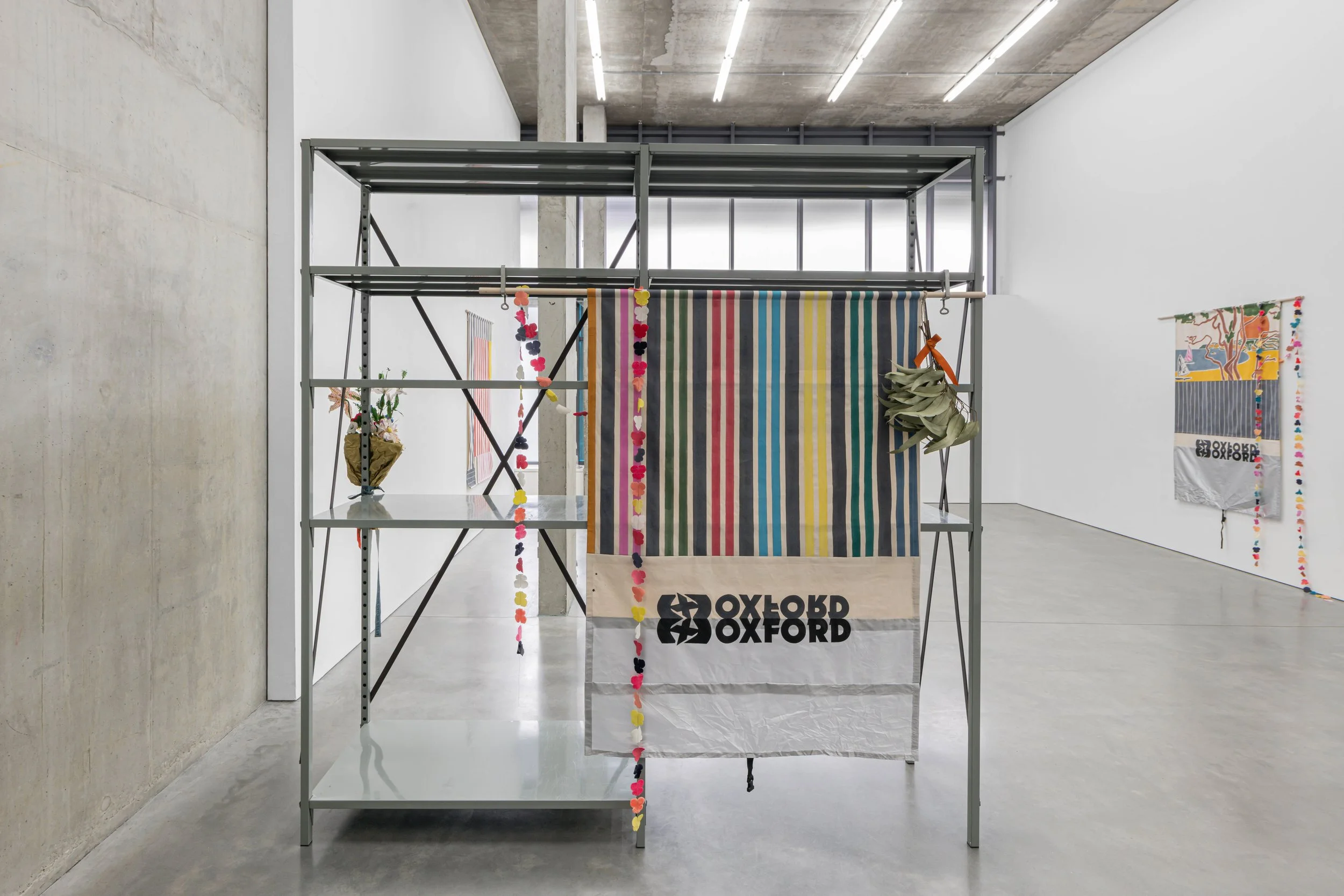   Sunsets &amp; Sailboats: Low Tide  (for Jarman), 2026  Acrylic &amp; pencil on scenic canvas, polyester rain cover, vintage velvet flowers, thread, dried eucalyptus leaves, ribbon, ash dowel  204 × 180 cm 