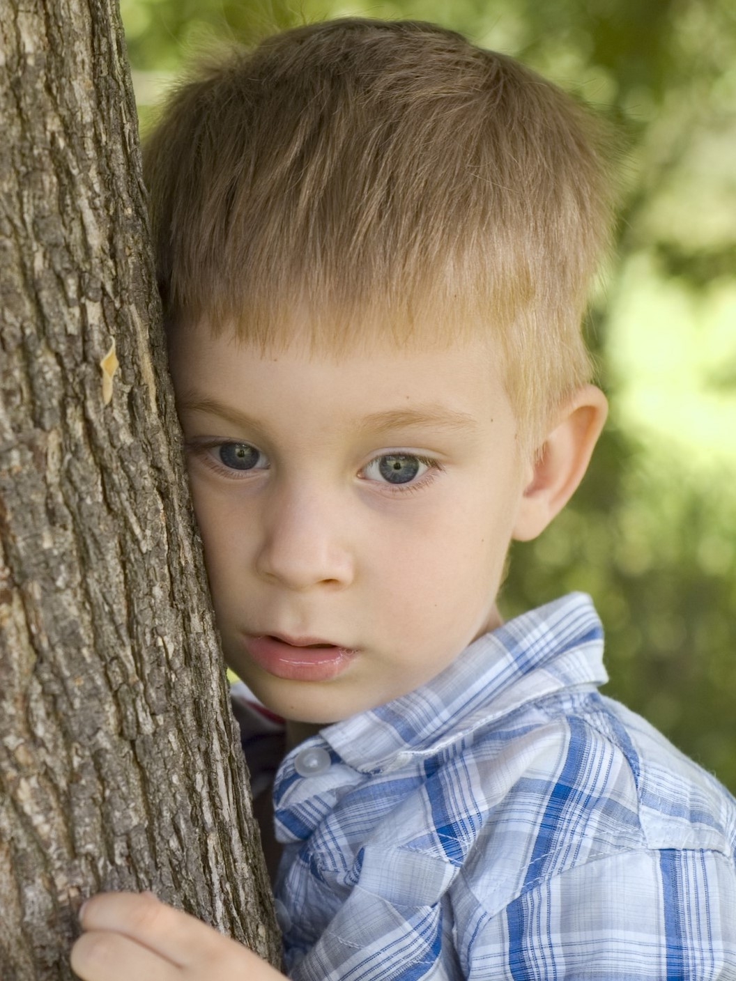 Sad child at tree (2).jpg