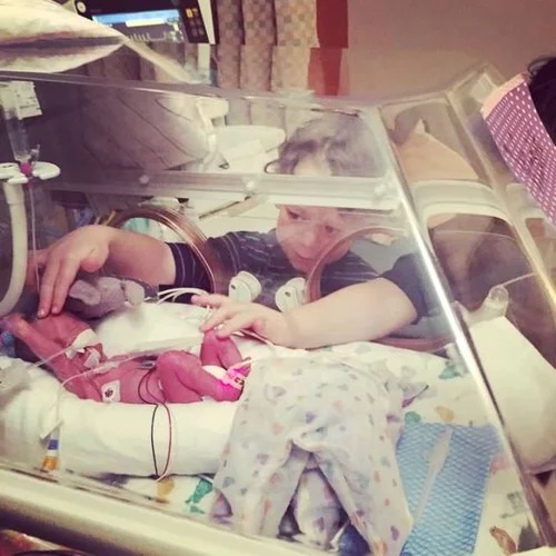 Jacquline’s sons checking in on baby sister