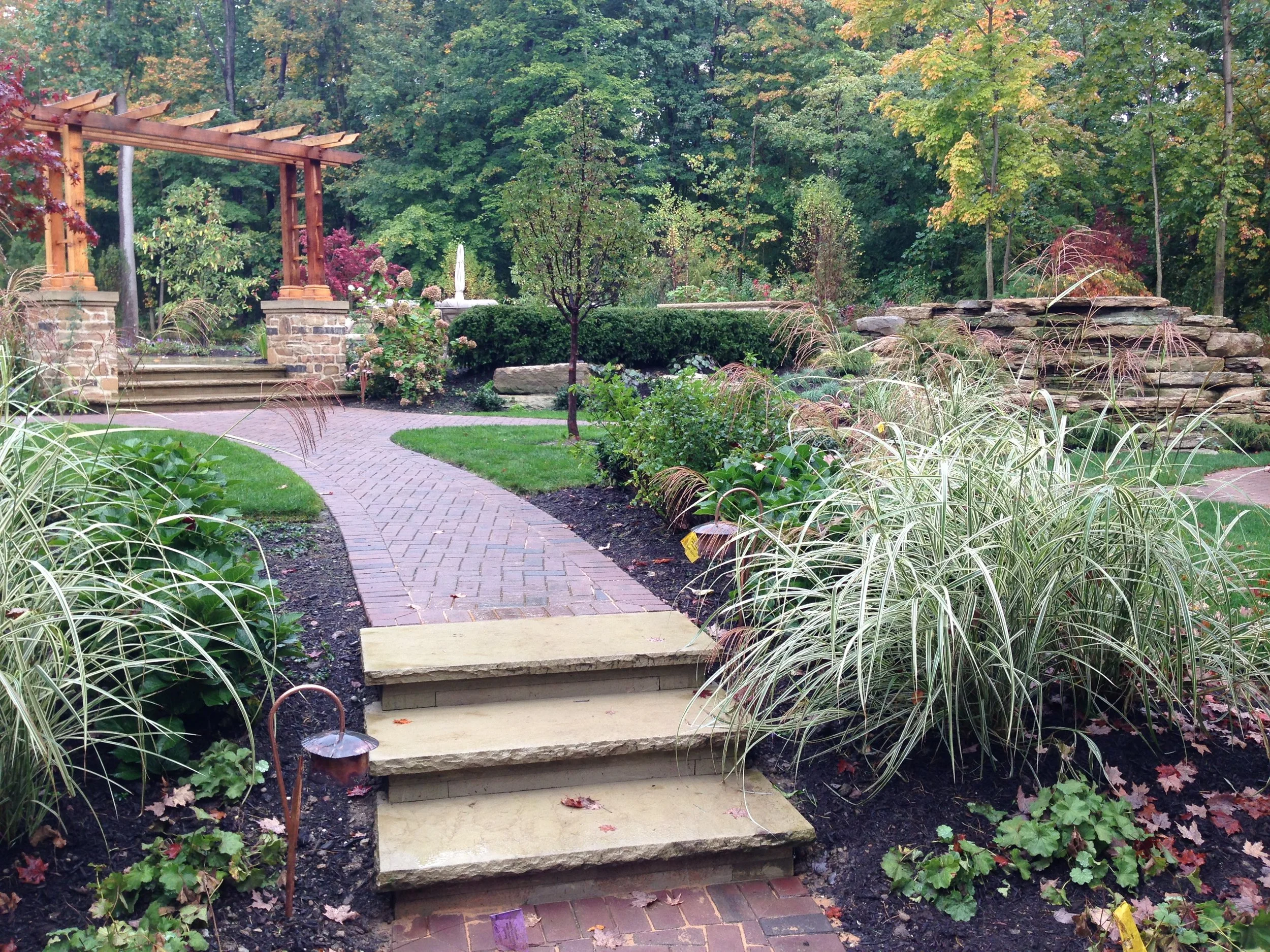Natural stone retaining wall in a Tremont, Ohio backyard