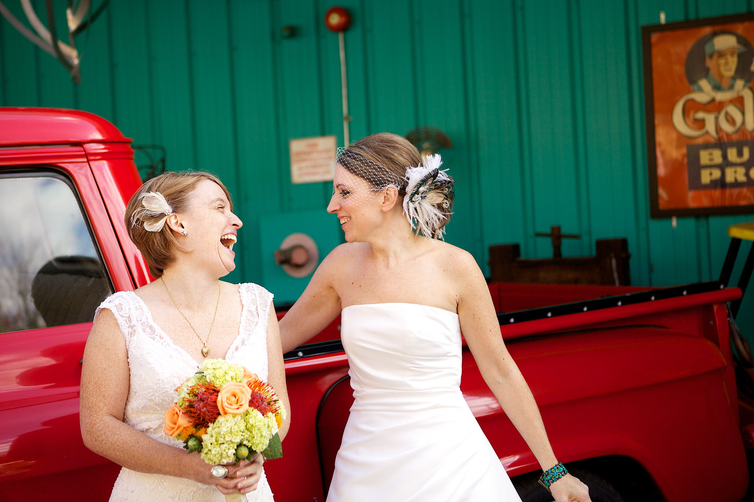 Two brides laughing at their gay wedding
