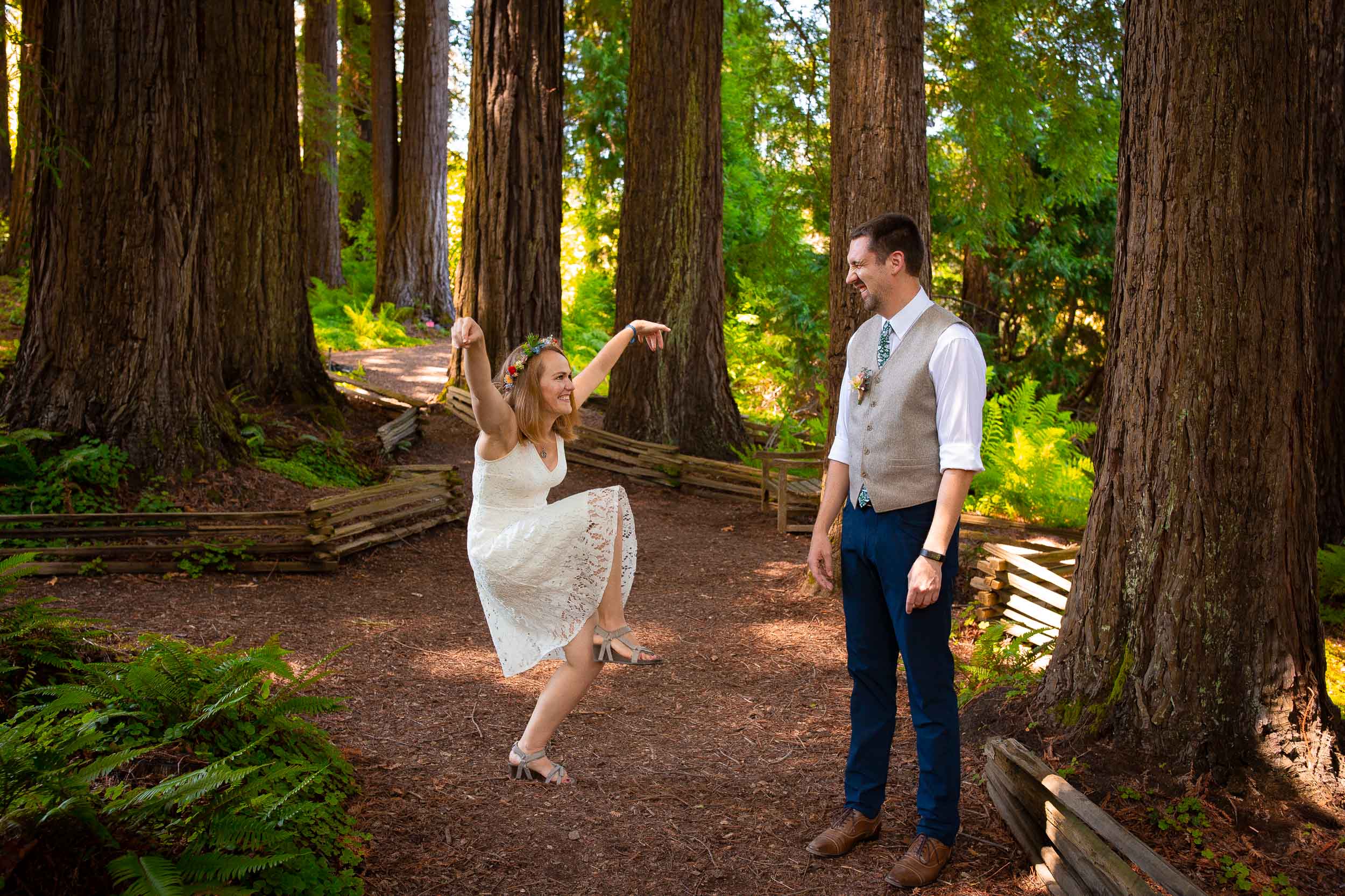 bride doing silly dance for groom at tilden botanical garden