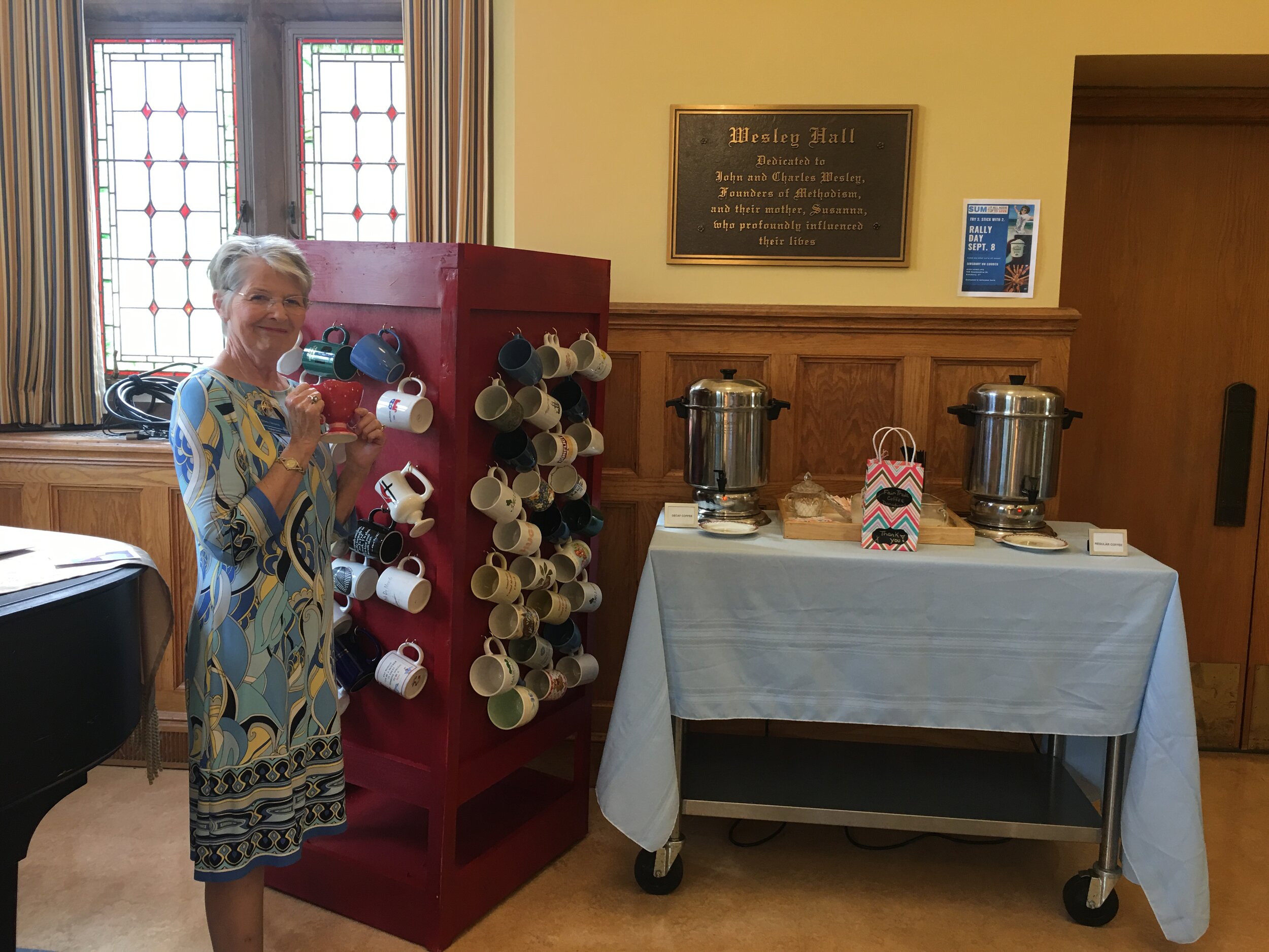 Barbara Vasquenza enjoys a cup of Fair Trade coffee on Rally Day.