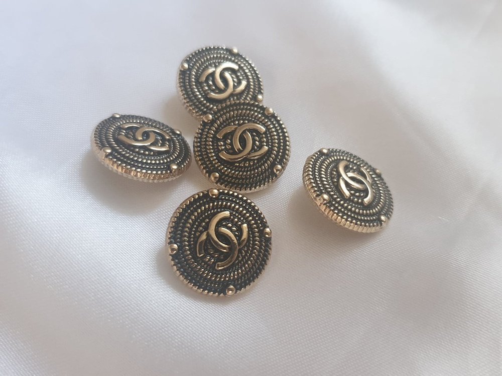 black and silver chanel buttons