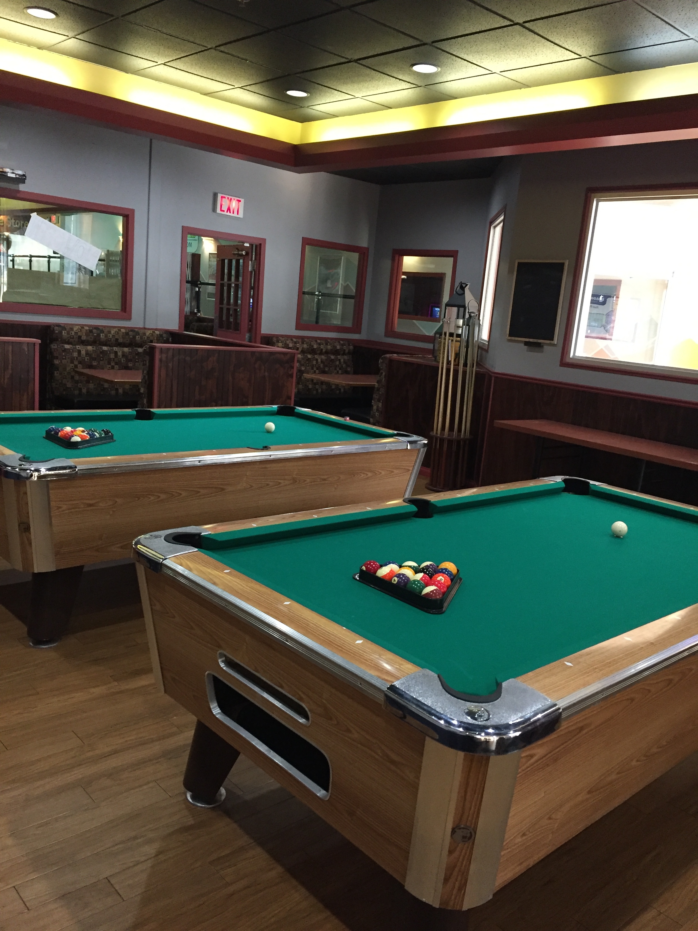 Pool hall with TV, serving food and drinks