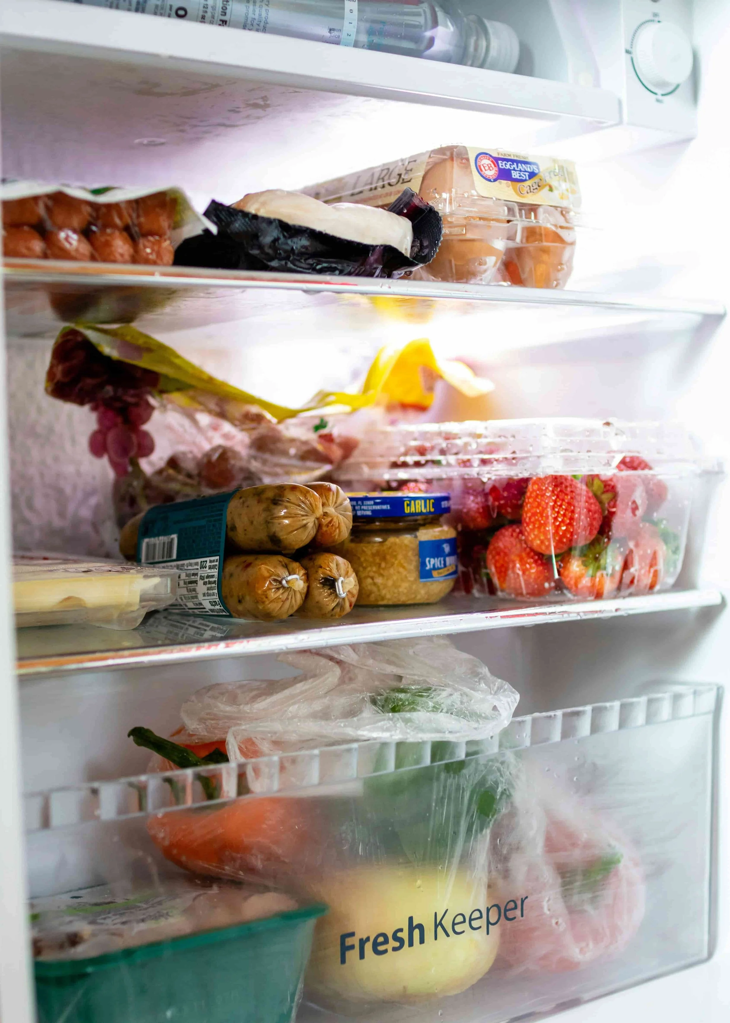 Staring into a fridge full of ingredients with no idea what to make for dinner.  Photo by Darrien Staton on Unsplash