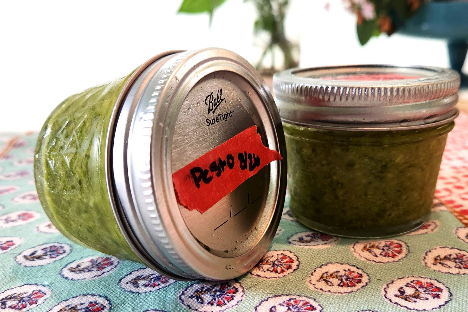 Jars of basil pesto labled, dated, and ready for the freezer