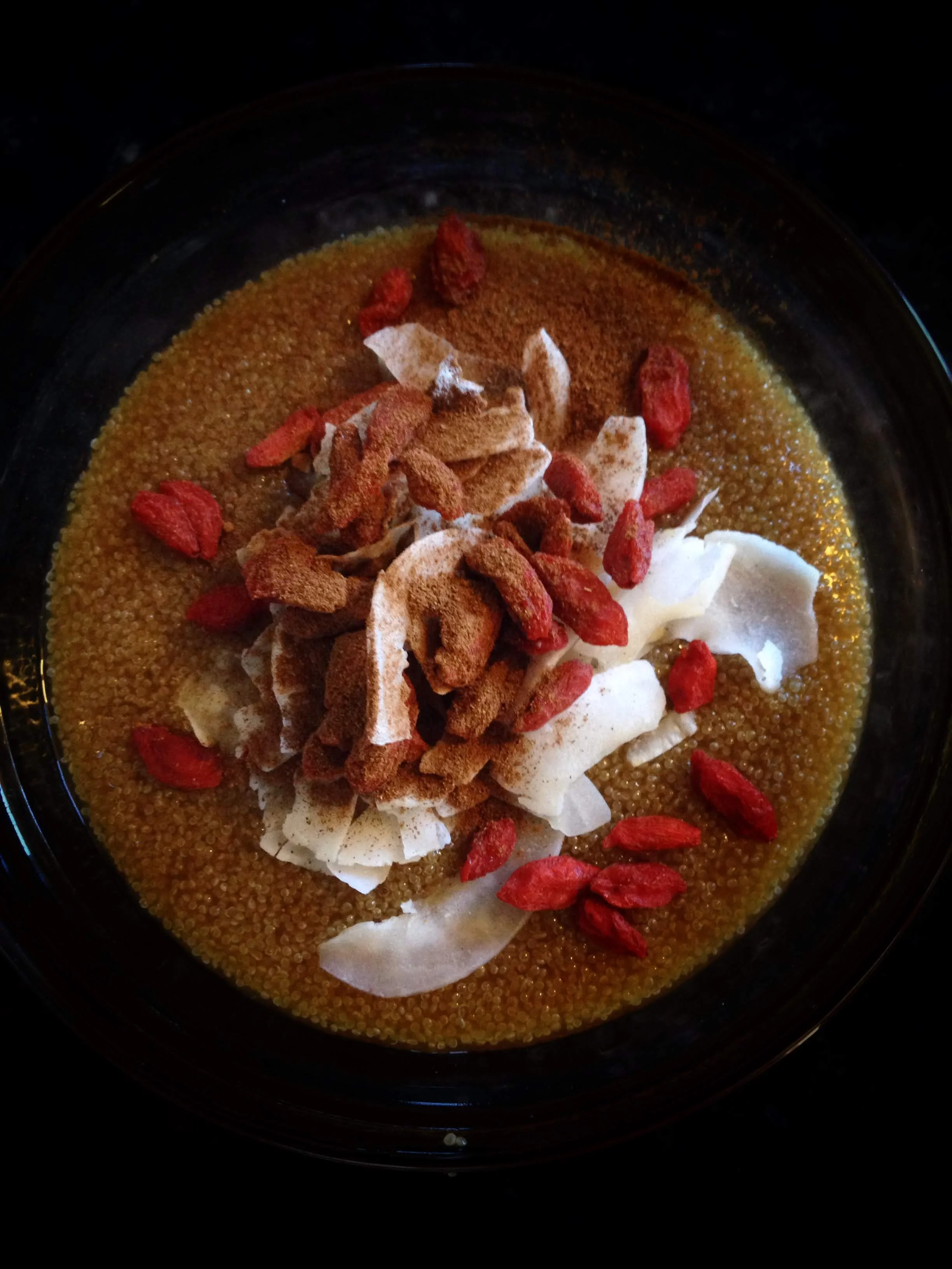 AMARANTH- Served hot with coconut, goji berries and cinnamon. Shot with iPhone 5 onFebruary 21, 2015.