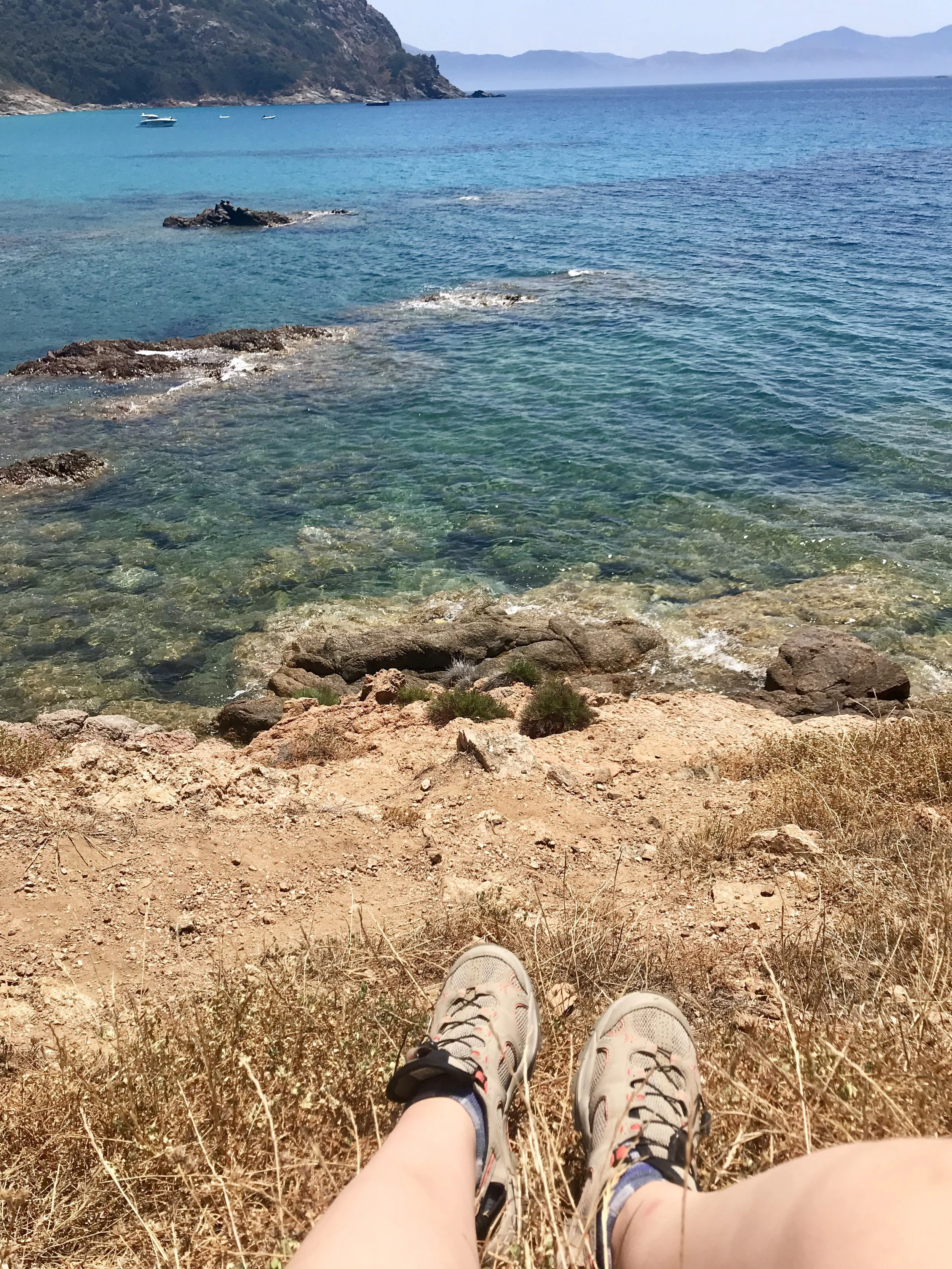 Admiring the Mediterranean shore during a (much needed) coffee break.