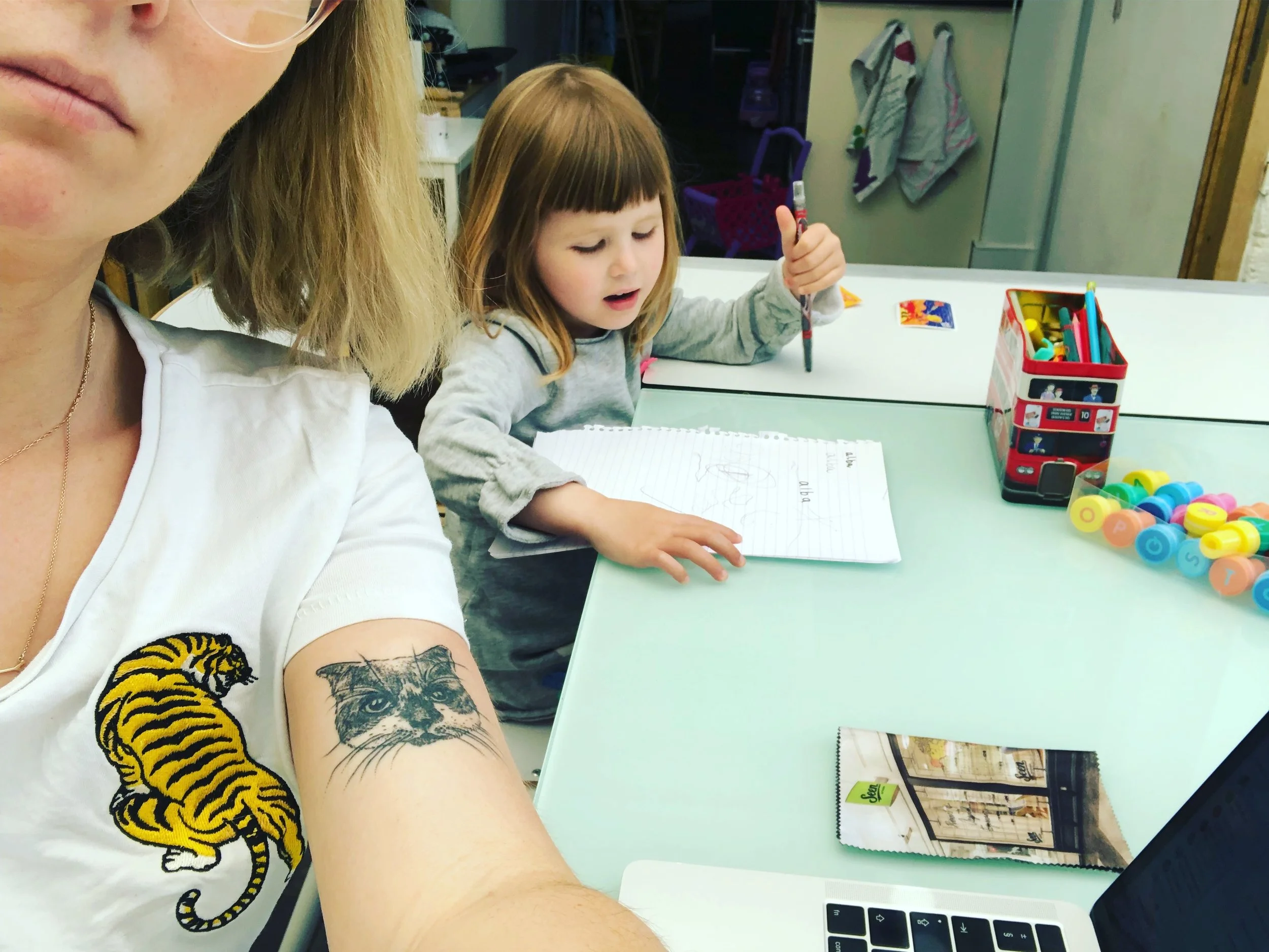 Anna Woolf, PhD candidate at Royal Central School of Speech and Drama. Writing part of my arts in health practice based theatre PhD whilst my daughter draws next to me.