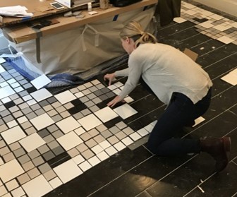 Tricia Huntley laying out master bath tile floor