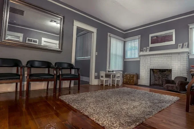 The waiting room is set up to comfortably pass the time for adults, children, and families