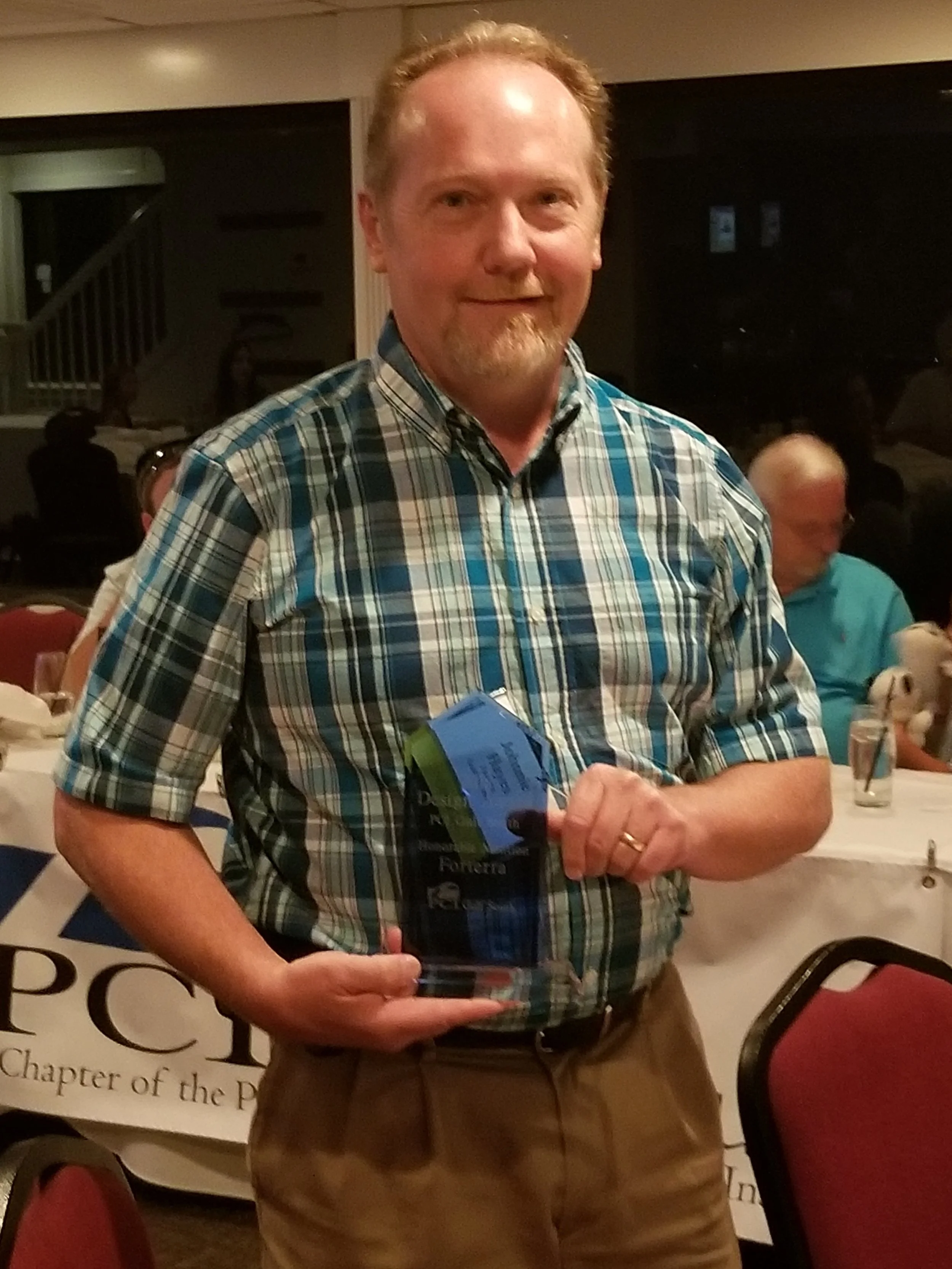 JOhnny from forterra accepting the 2018 honorable mention award.