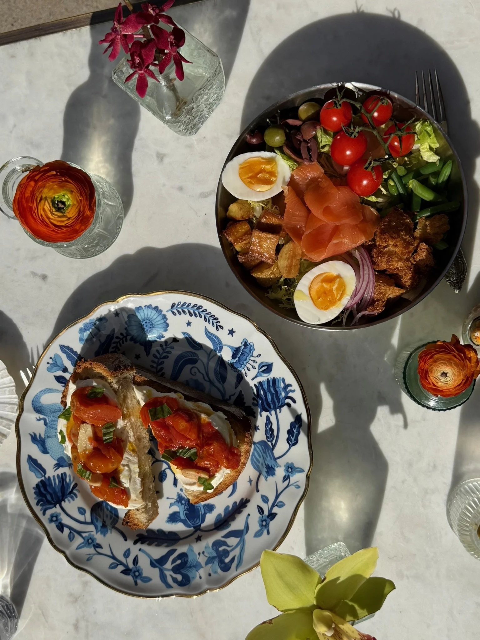 Niçoise salad and ricotta tomato toast served at Elephantine Bakery in Boston’s Fort Point