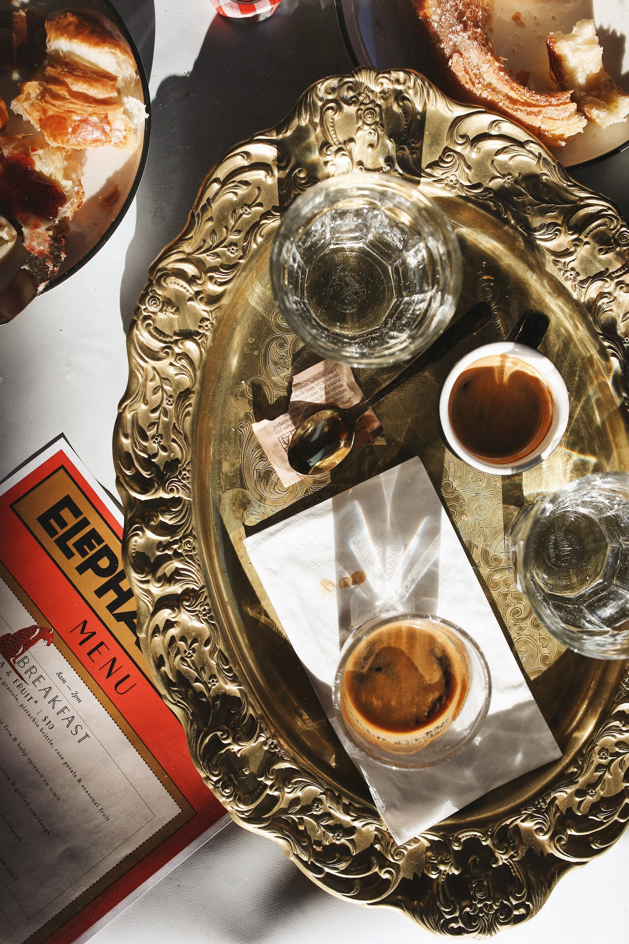 Coffee served on a gold tray at Elephantine Bakery & Café in Portsmouth, New Hampshire, reflecting a tradition of thoughtful hospitality.
