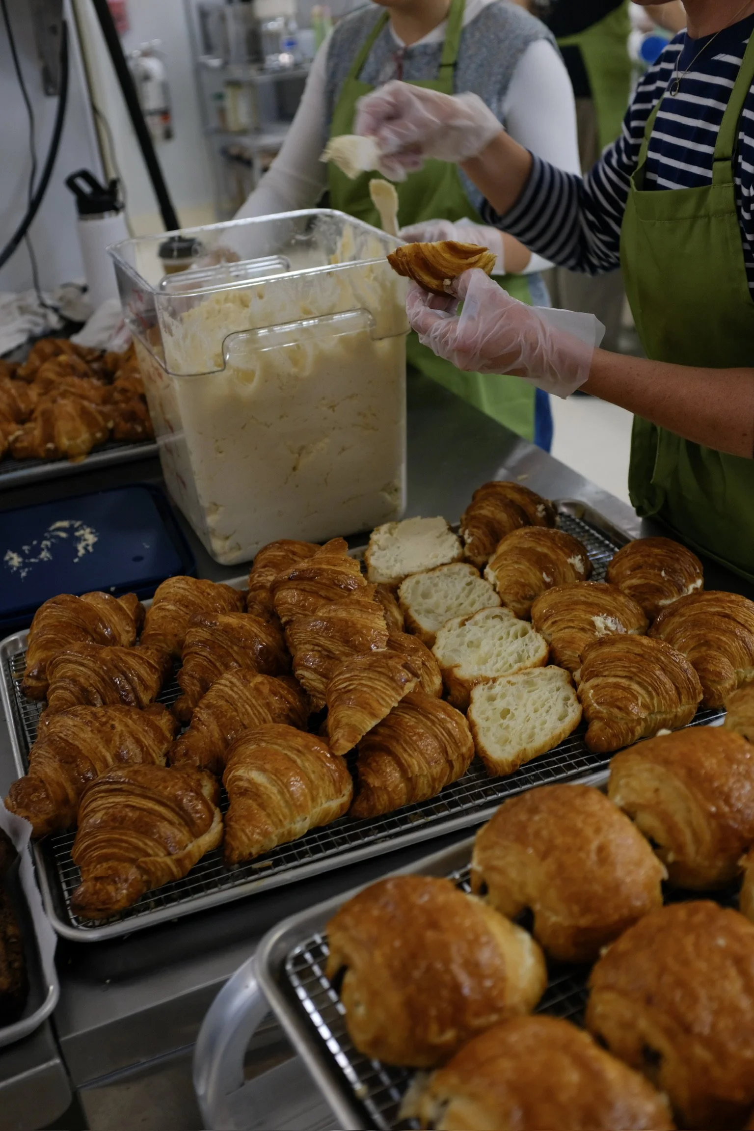 Elephantine Boston café team making small batch almond croissants in our Fort Point bakery and café