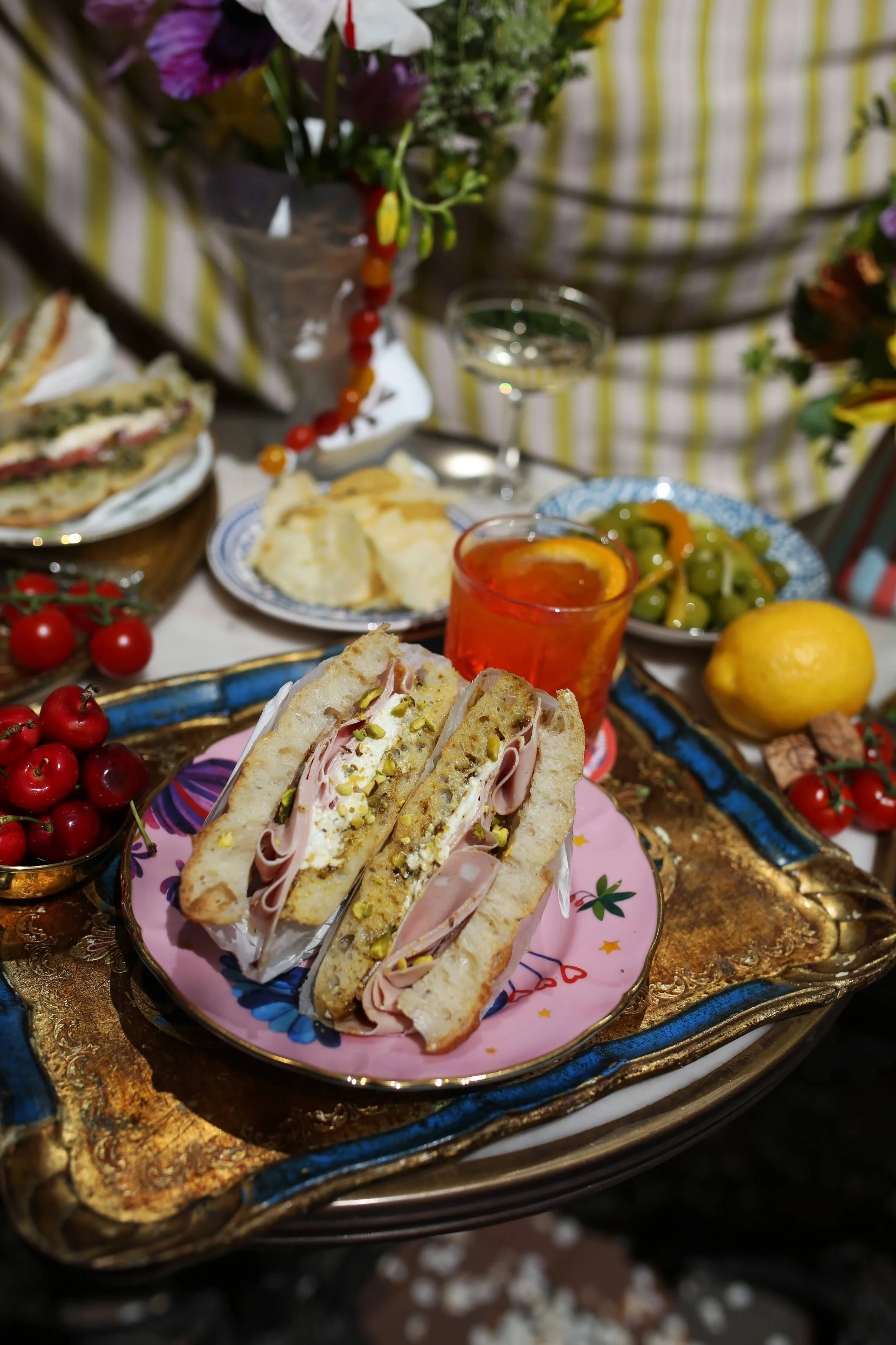Italian aperitivo with mortadella focaccia and an Aperol spritz served at Elephantine Bakery in Boston’s Fort Point near the Seaport