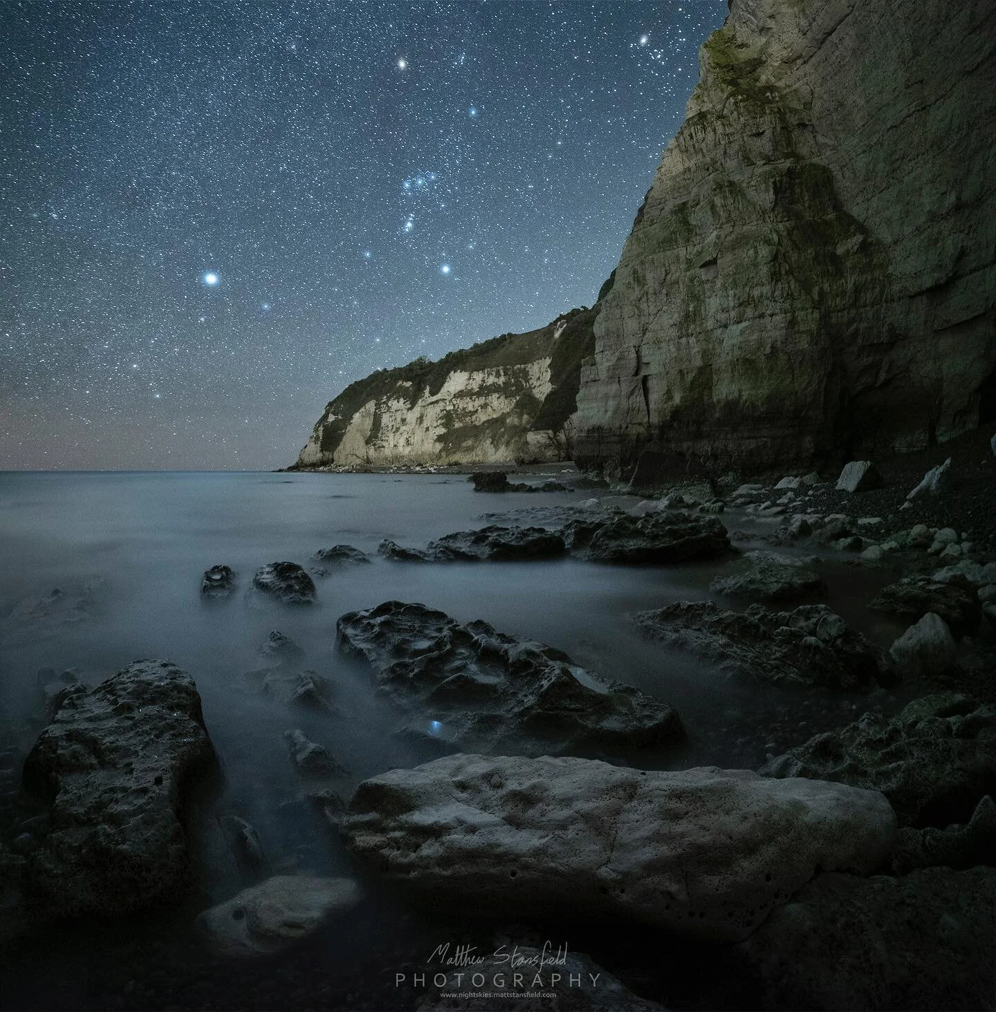 Pound Beach - Devon
Web: www.nightskies.mattstansfield.com

Story:  Another variation from my last astro trip to the south coast of Devon. I positioned the camera low for this image to bring some interesting rocks and water movement into the composit