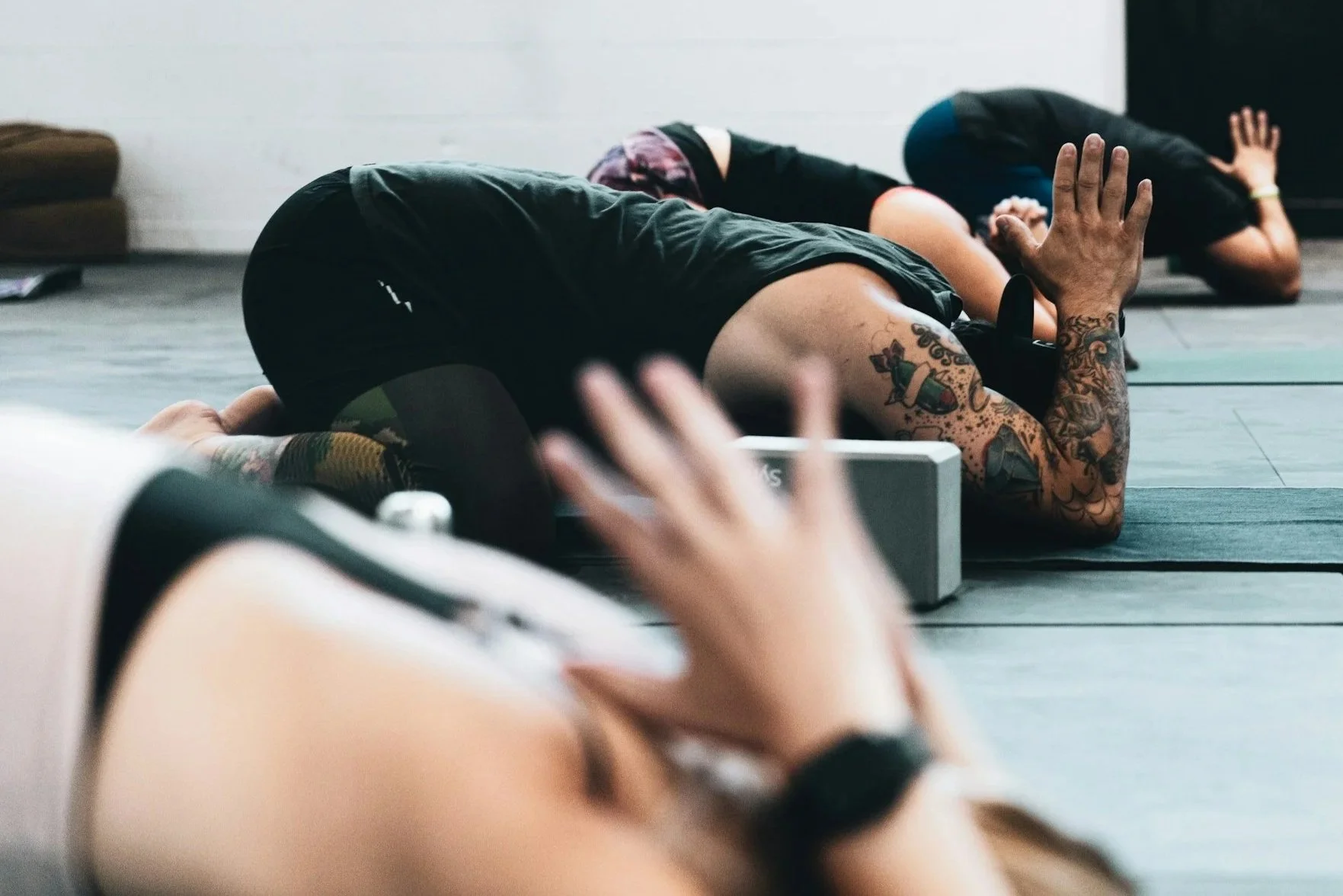 People of different genders practicing yoga