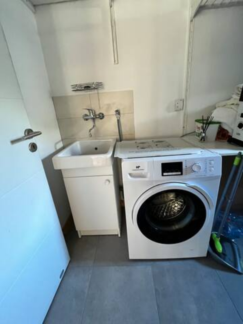 Utility Room with Washing Machine & Sink (12).png