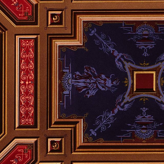 Cesar Daly designed many architectural surfaces like this purple and gold ceiling, with painted blue maidens, wind tossed garments, staring down from above.

#architecture #interior #purple #gold #maiden #garments #ceiling #ornament #chromolithograph