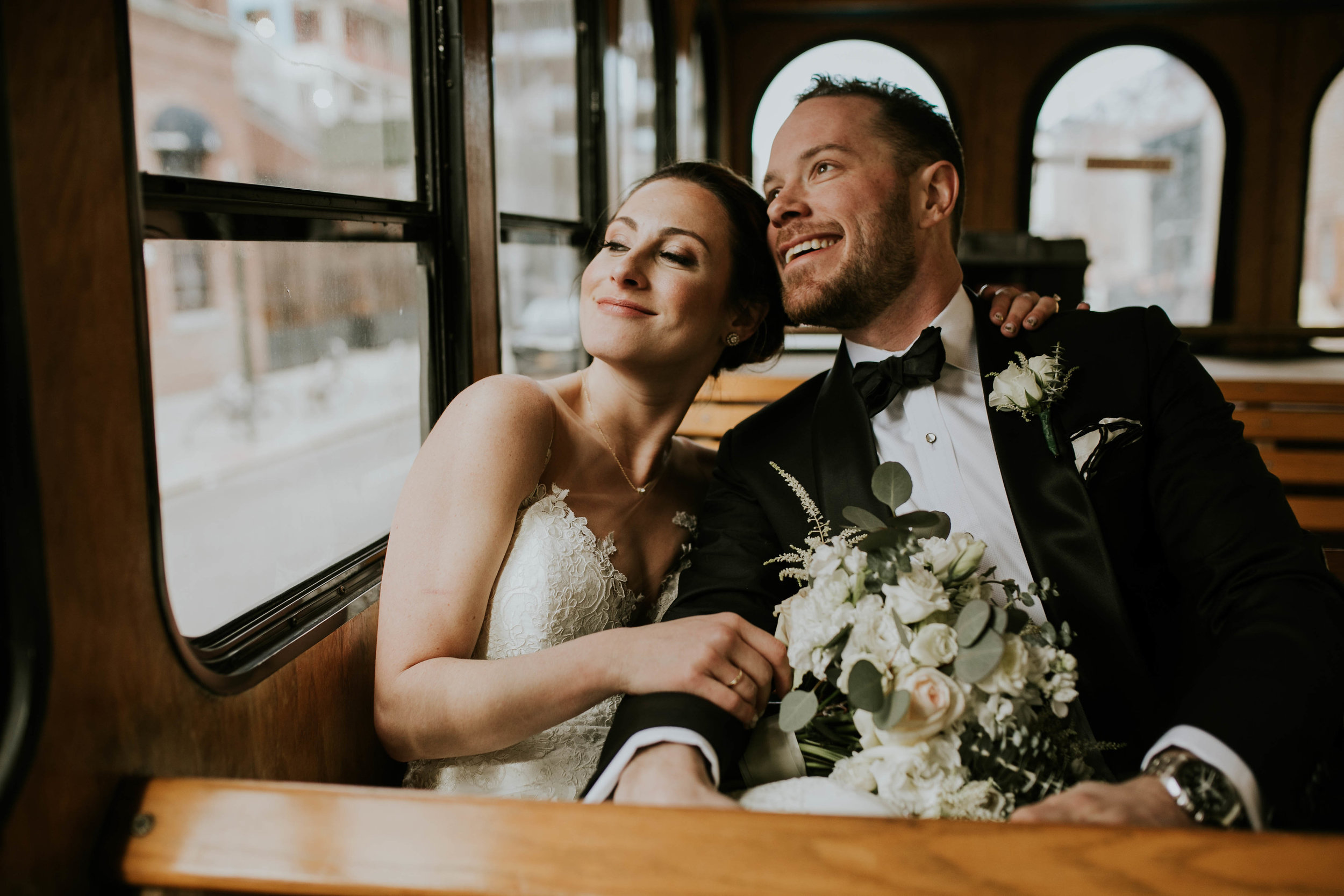 nyc wedding couple on a trolley limo