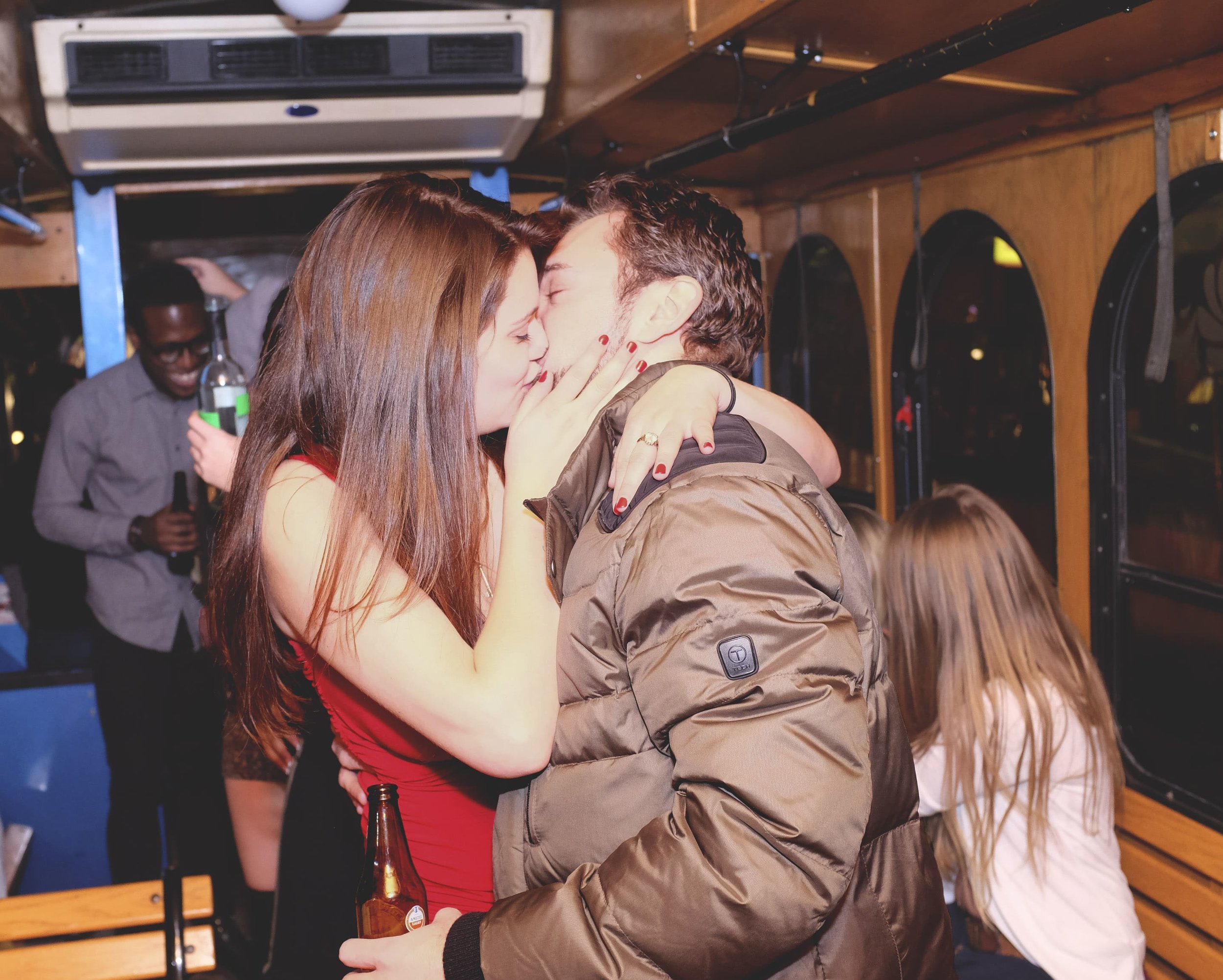 kissing on a trolley party bus