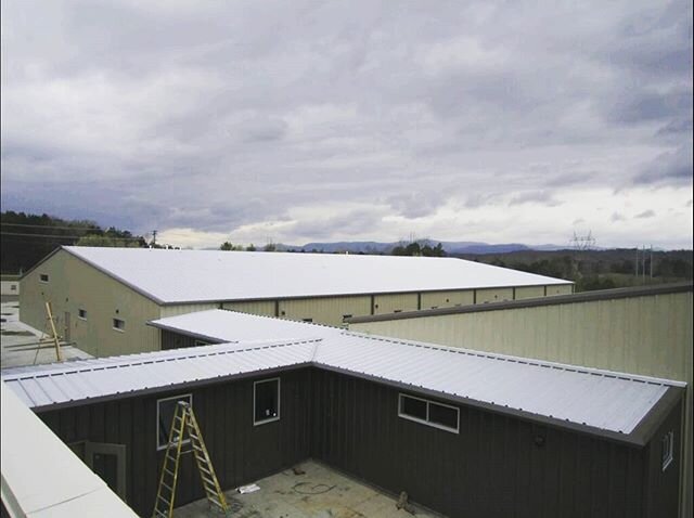 #cloudyskies and #rainyday photo. We completed this school project with @sbusby1964 2 years ago. Keeping the weather out is the first job of a building, and we hope all of ya'll stay nice and dry this week!